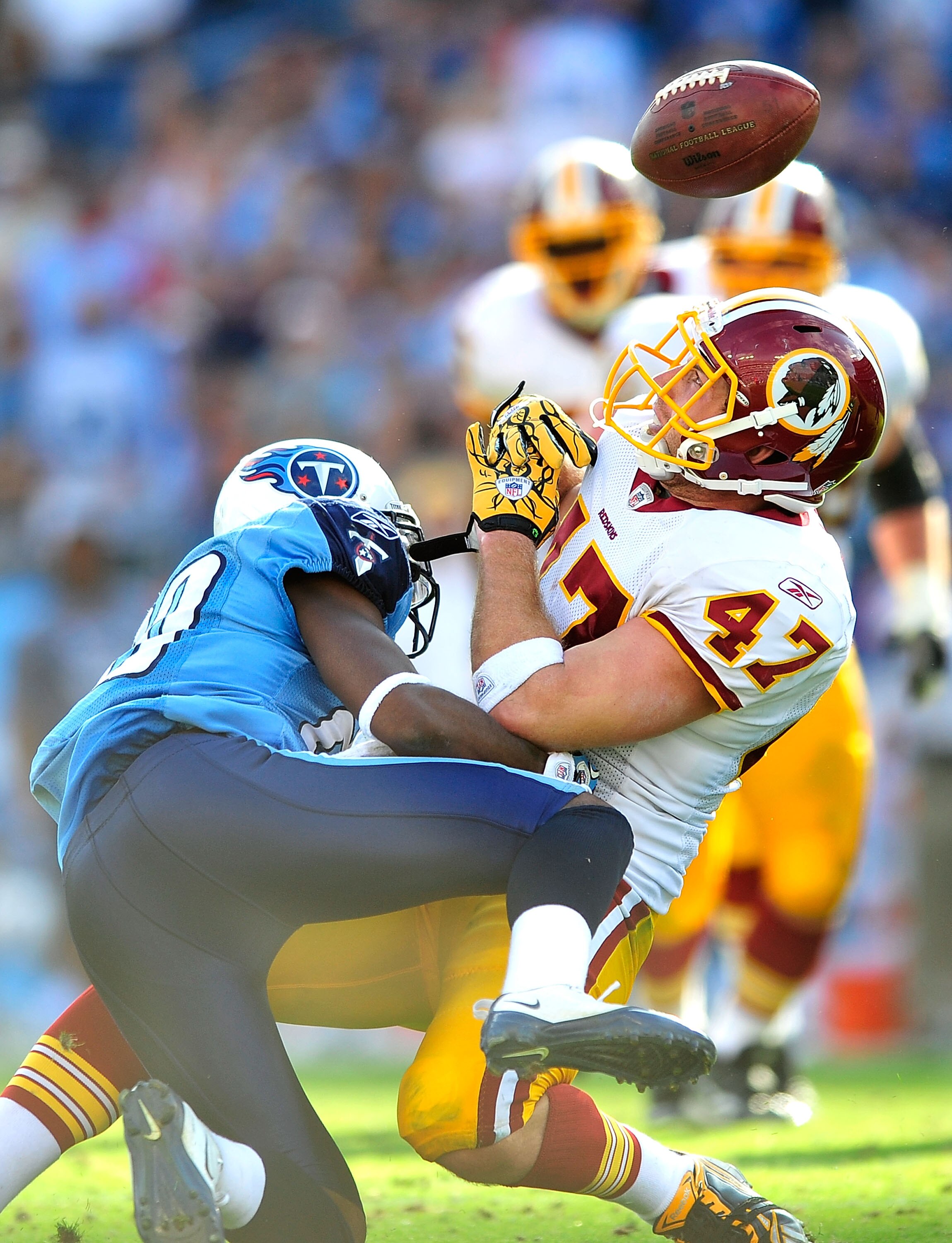 NASHVILLE, TN - NOVEMBER 21:  Alterraun Verner #20 of the Tennessee Titans braks up a pass intended for Chris Cooley #47 of the Washington Redskins at LP Field on November 21, 2010 in Nashville, Tennessee. The Redskins won 19-16 in overtime.  (Photo by Gr