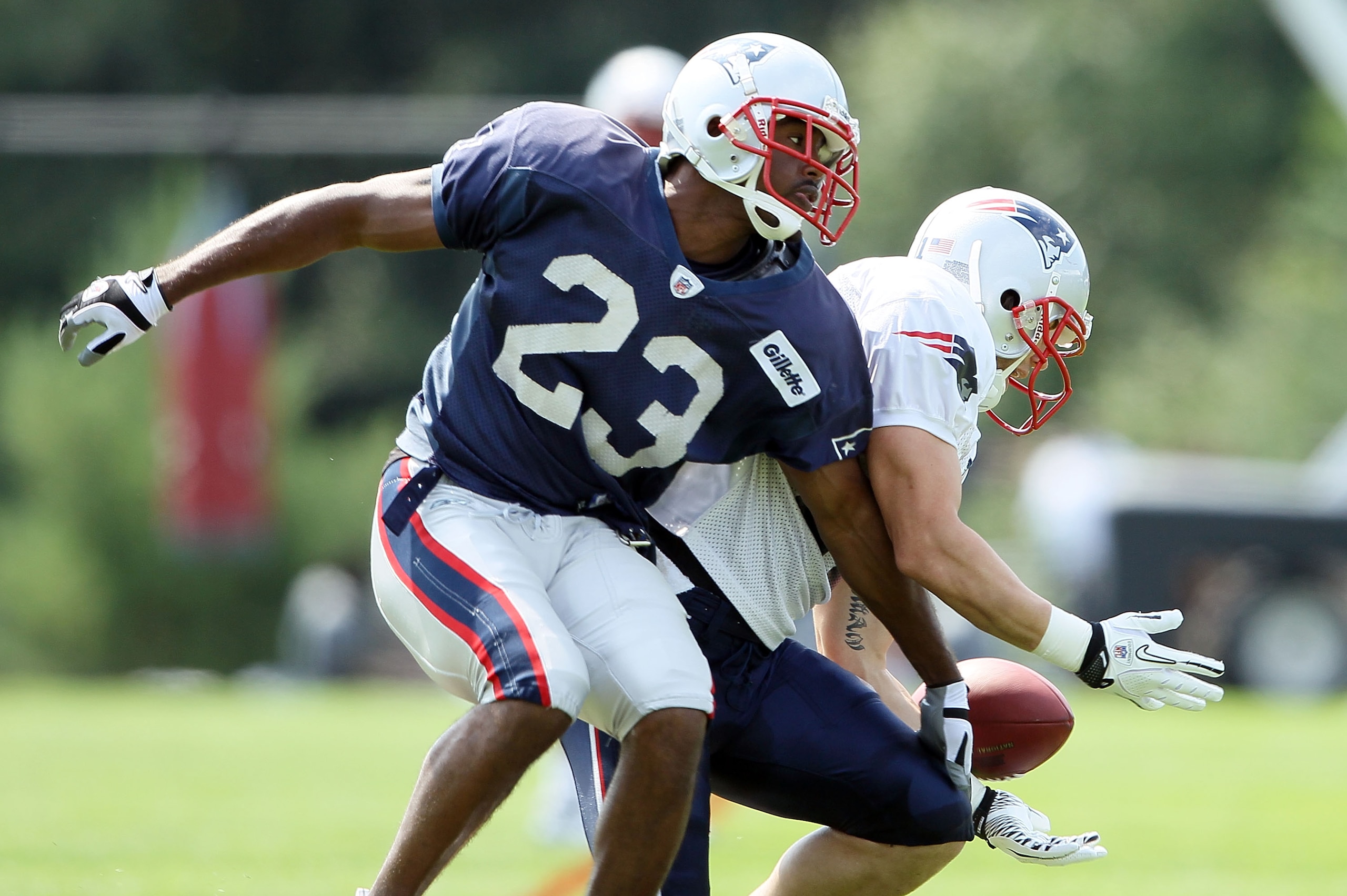 FOXBORO, MA - AUGUST 02:  Leigh Bodden #23 breaks up a pass intended for Julian Edelman #11 during the New England Patriots training camp on August 2, 2010 at Gillette Stadium in Foxboro, Massachusetts.  (Photo by Elsa/Getty Images)