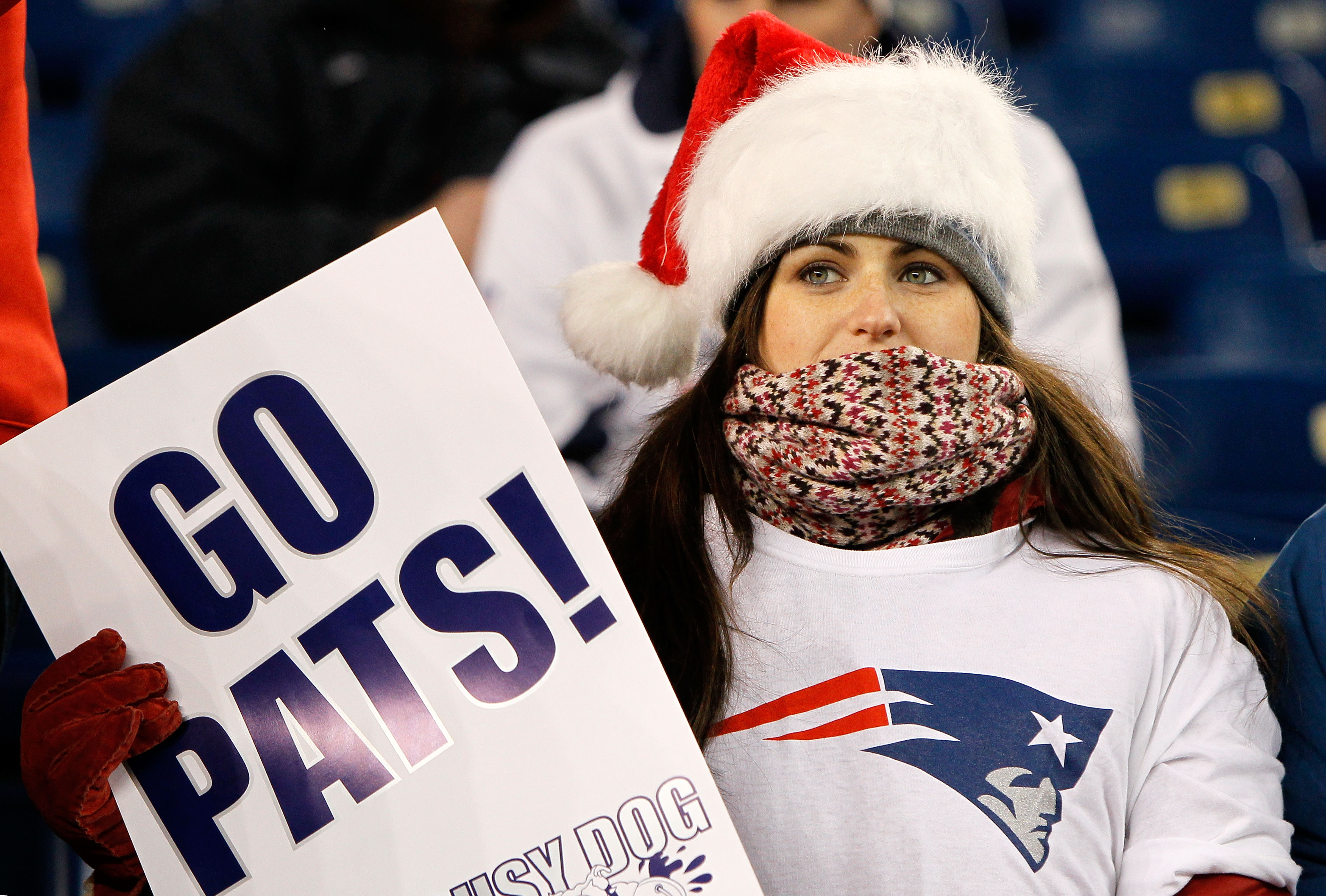 FOXBOROUGH, MA - DECEMBER 24: A New England Patriots fan wearing a foam  Patriots hat and dressed as Santa Claus attends a game between the New  England Patriots and the Cincinnati Bengals