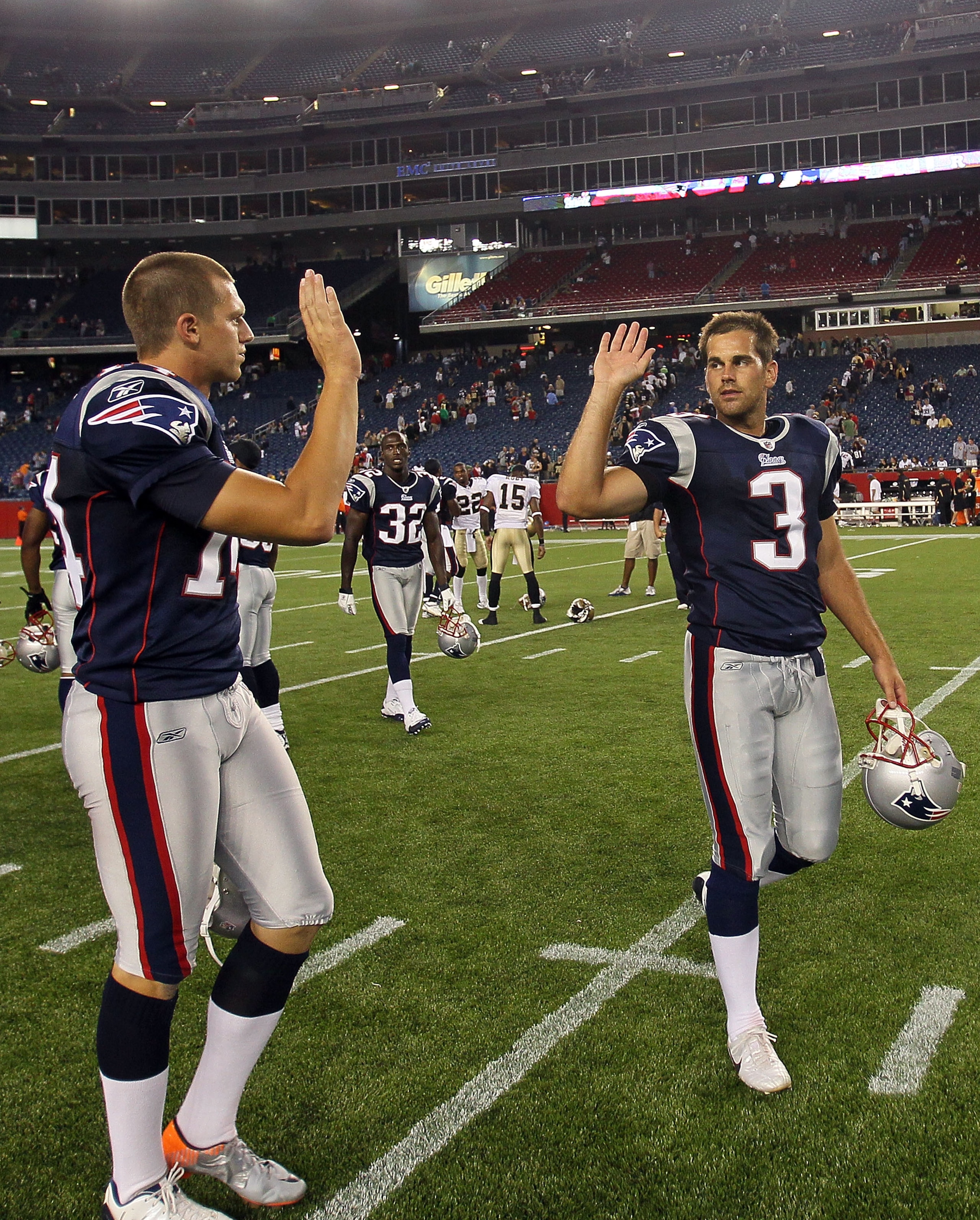 FOXBORO, MA - AUGUST 12: Zoltan Mesko # 14 and Stephen Gostkowski # 3 of the New England Patriots celebrate their 27 - 24 win over the New Orleans Saints at the end of a preseason game at Gillette Stadium on August 12, 2010 in Foxboro, Massachusetts. (Pho