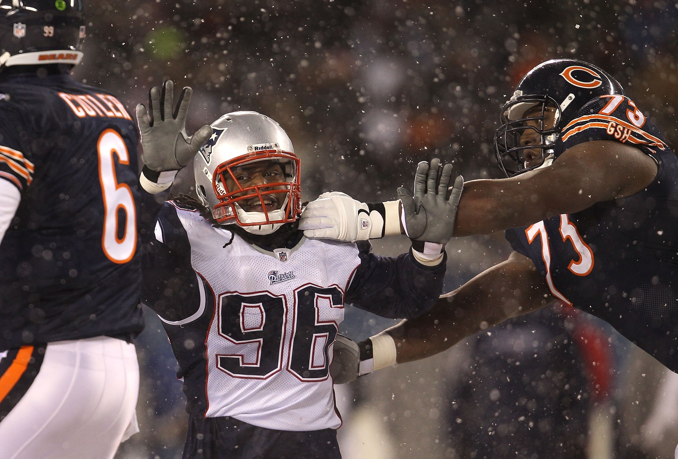 CHICAGO - DECEMBER 12: Jermaine Cunningham #96 of the New England Patriots rushes past J'Marcus Webb #73 of the Chicago Bears towards Jay Cutler #6 at Soldier Field on December 12, 2010 in Chicago, Illinois. The Patriots defeated the Bears 36-7. (Photo by