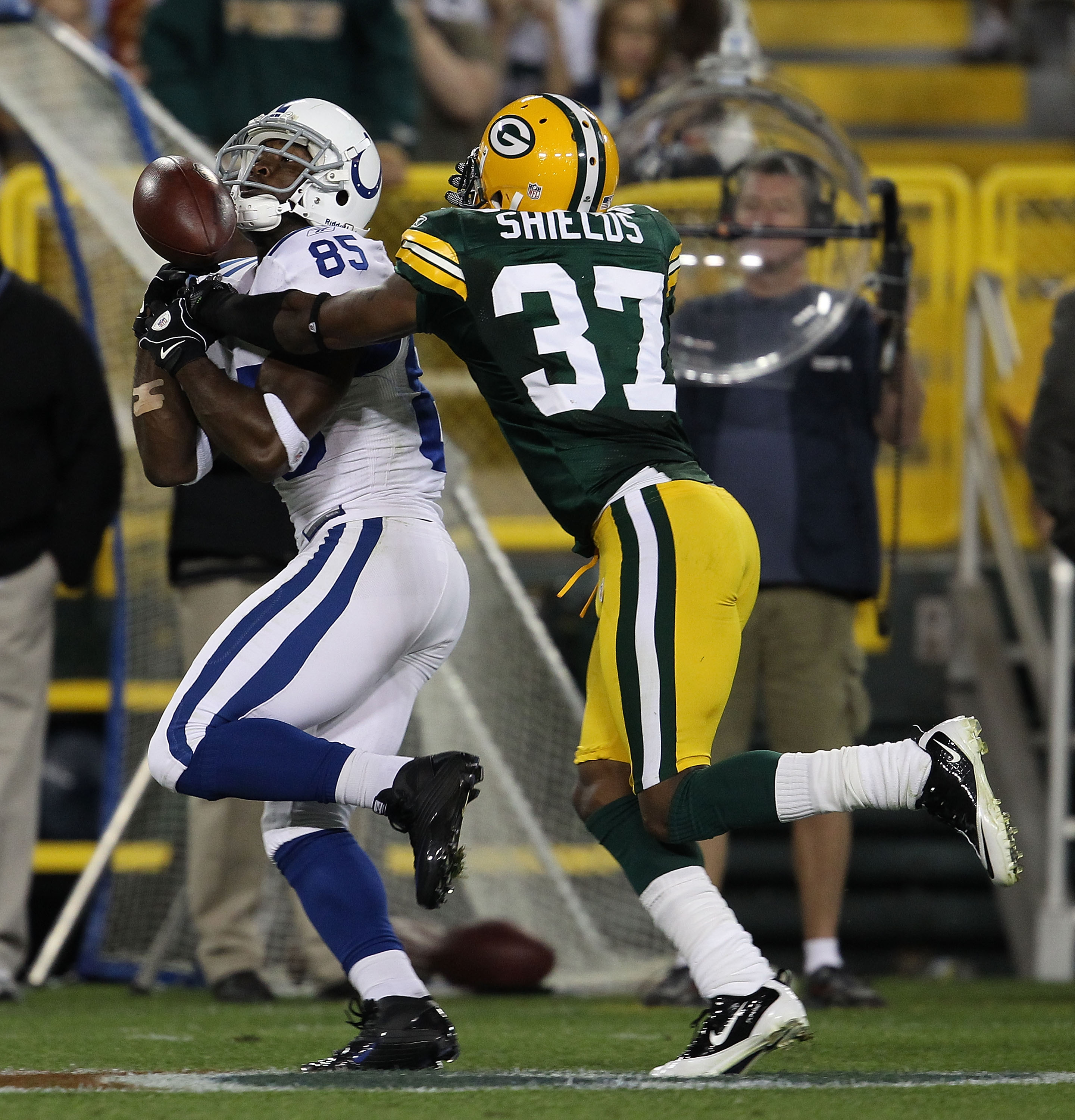 GREEN BAY, WI - AUGUST 26: Sam Shields #37 of the Green Bay Packers breaks up a pass intended for Pierre Garcon #85 of the Indianapolis Colts during a preseason game at Lambeau Field on August 26, 2010 in Green Bay, Wisconsin. The Packers defeated the Col