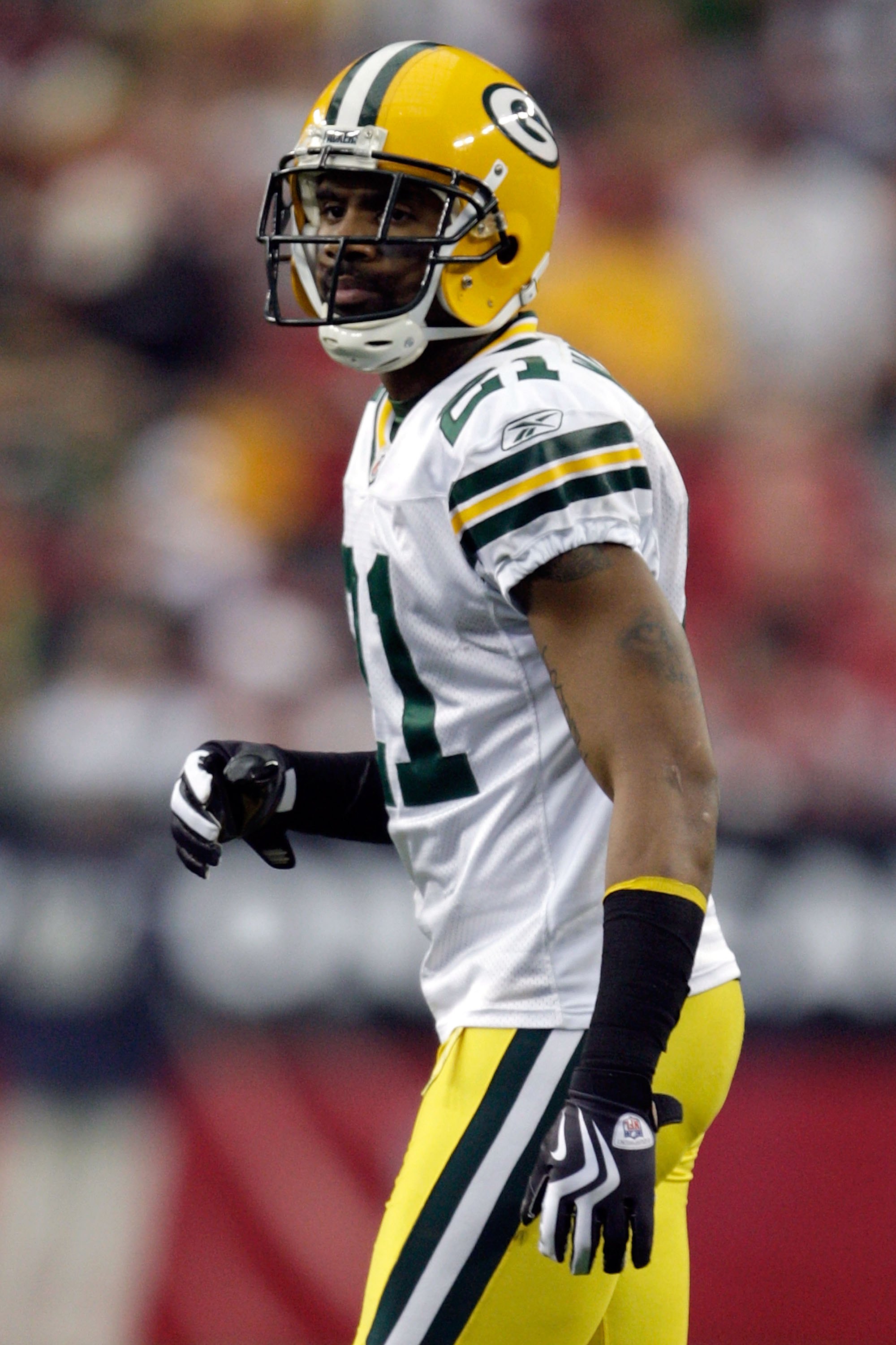 GLENDALE, AZ - JANUARY 03:  Charles Woodson #21 of the Green Bay Packers looks on from the field against the Arizona Cardinals in the second quarter at University of Phoenix Stadium on January 3, 2010 in Glendale, Arizona.  (Photo by Jamie Squire/Getty Im