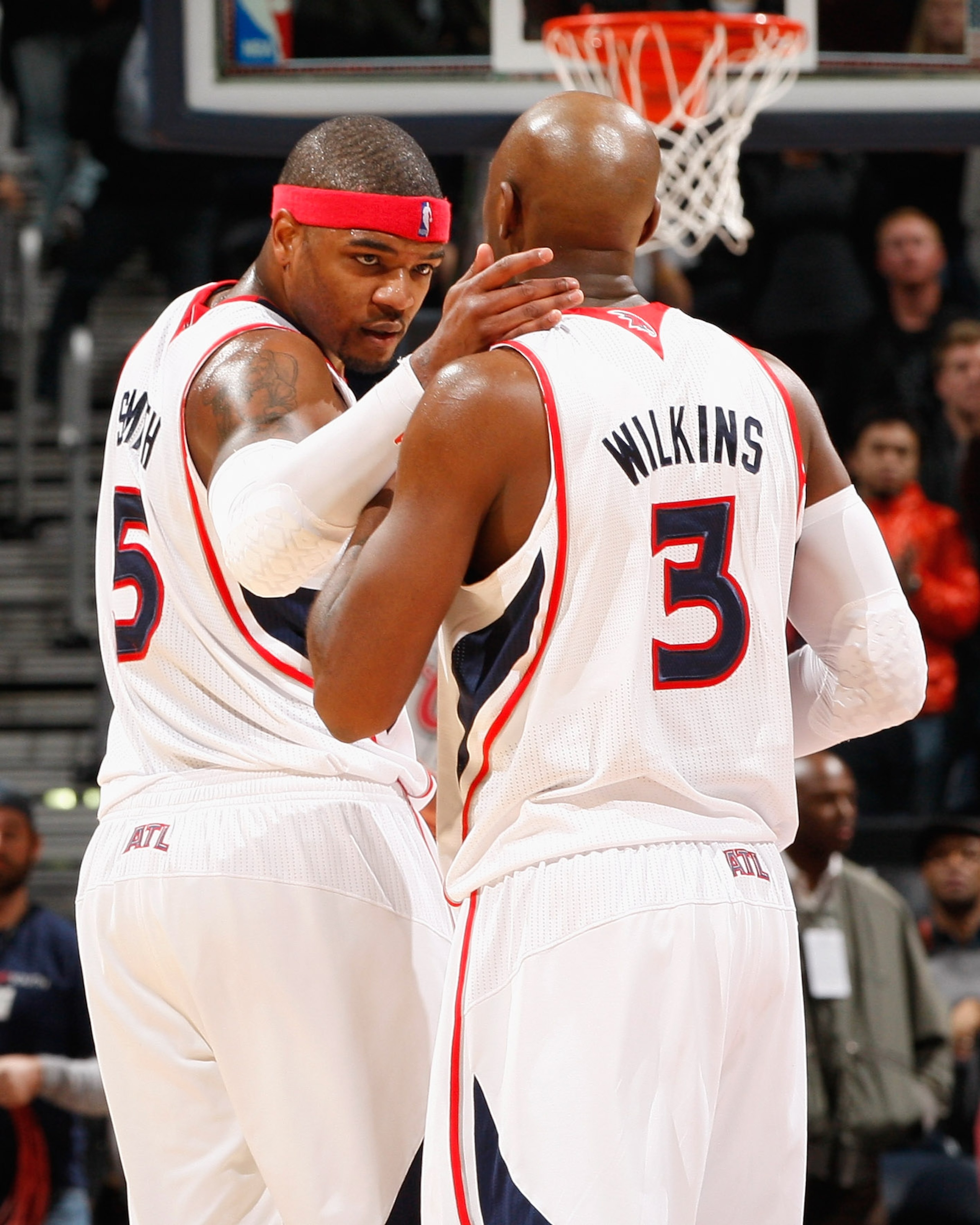 ATLANTA, GA - DECEMBER 11:  Josh Smith #5 and Damien Wilkins #3 of the Atlanta Hawks celebrate their 97-83 win over the Indiana Pacers at Philips Arena on December 11, 2010 in Atlanta, Georgia.  NOTE TO USER: User expressly acknowledges and agrees that, b