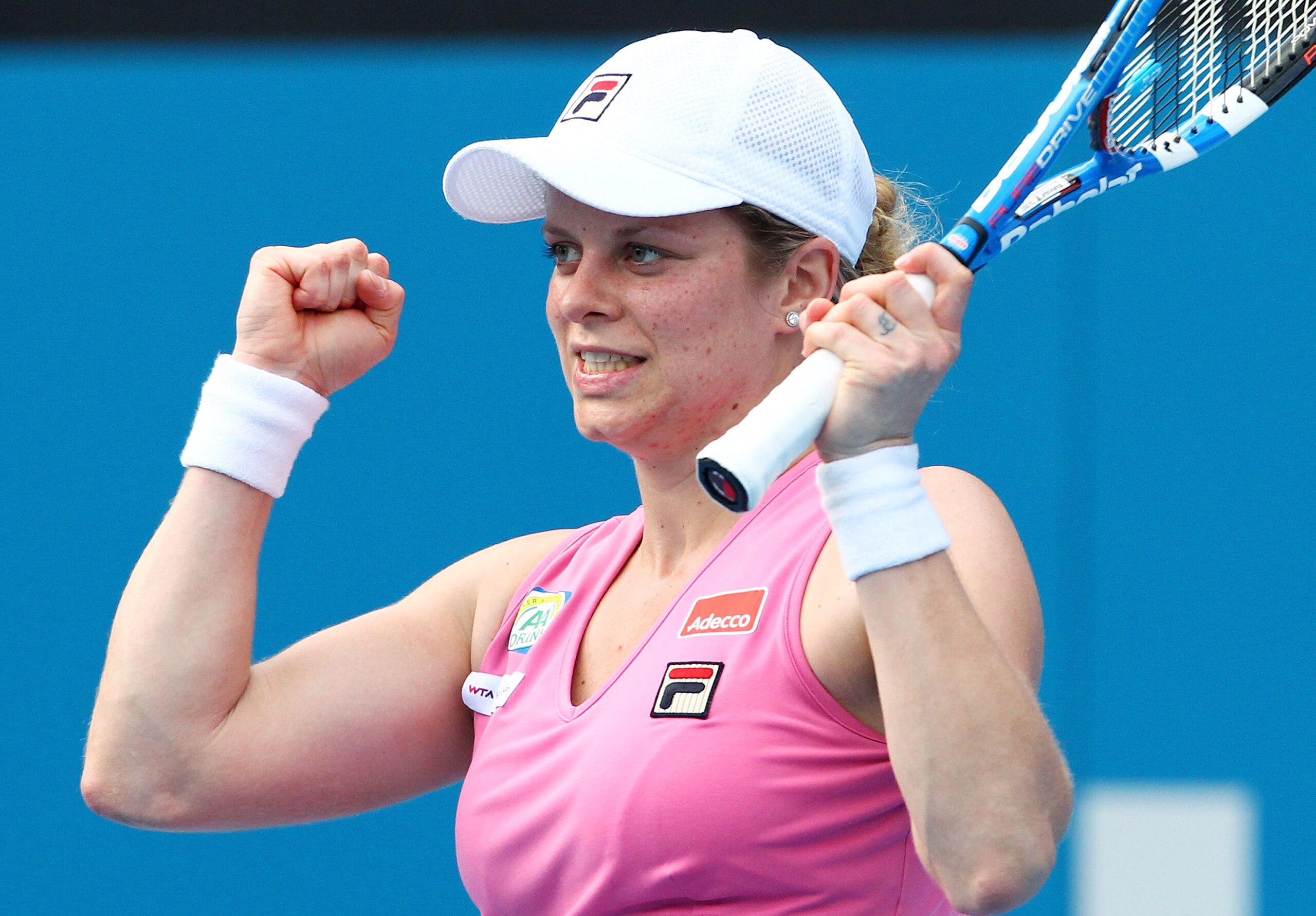SYDNEY, AUSTRALIA - JANUARY 13:  Kim Clijsters of Belgium celebrates winning her match against Alisa Kleybanova of Russia during day five of the 2011 Medibank International at Sydney Olympic Park Tennis Centre on January 13, 2011 in Sydney, Australia.  (P