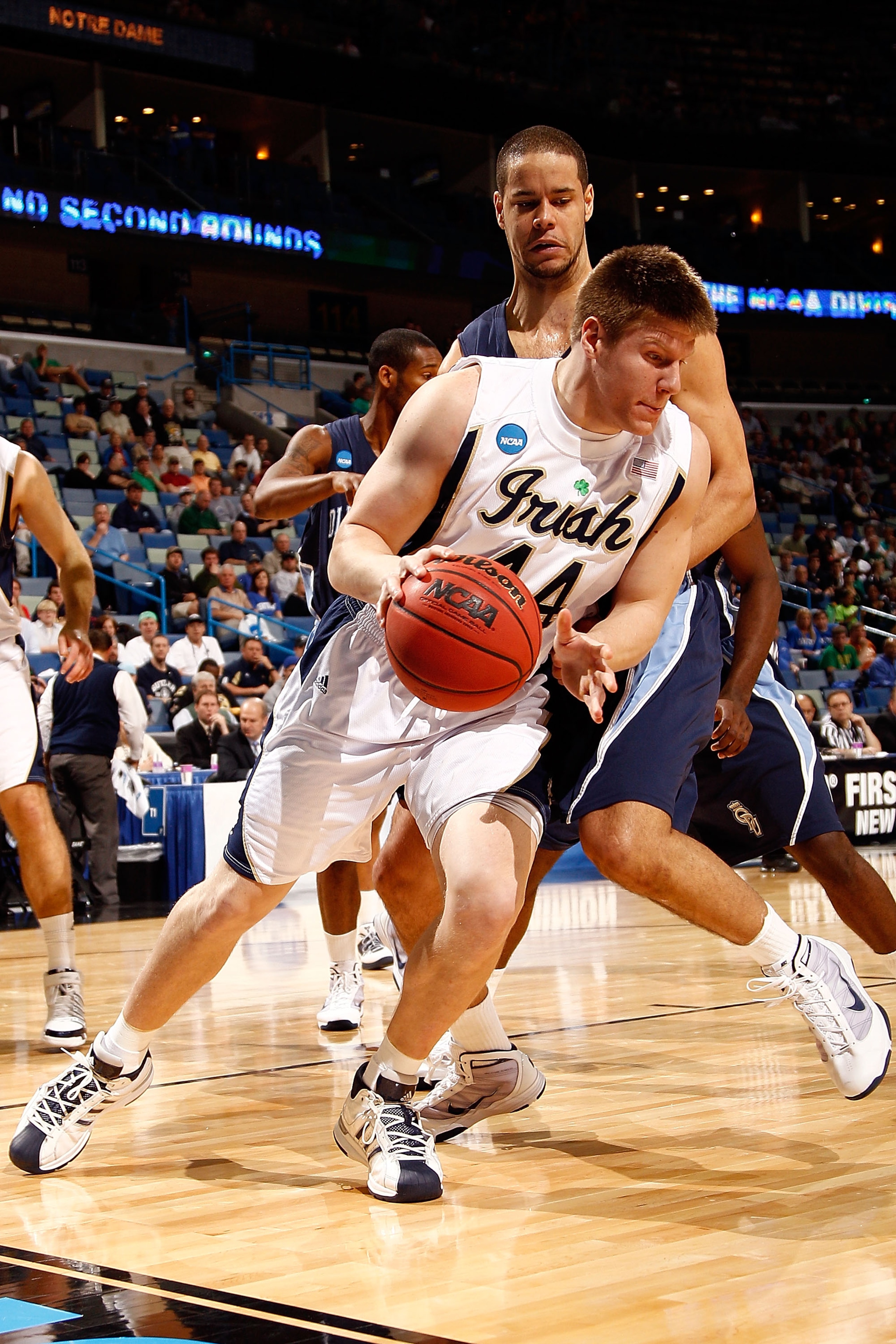 NEW ORLEANS - MARCH 18:  Luke Harangody #44 of the Notre Dame Fighting Irish drives the ball around Frank Hassell #21 of the Old Dominion Monarchs during the first round of the 2010 NCAA menï¿½s basketball tournament at the New Orleans Arena on March 18, 20
