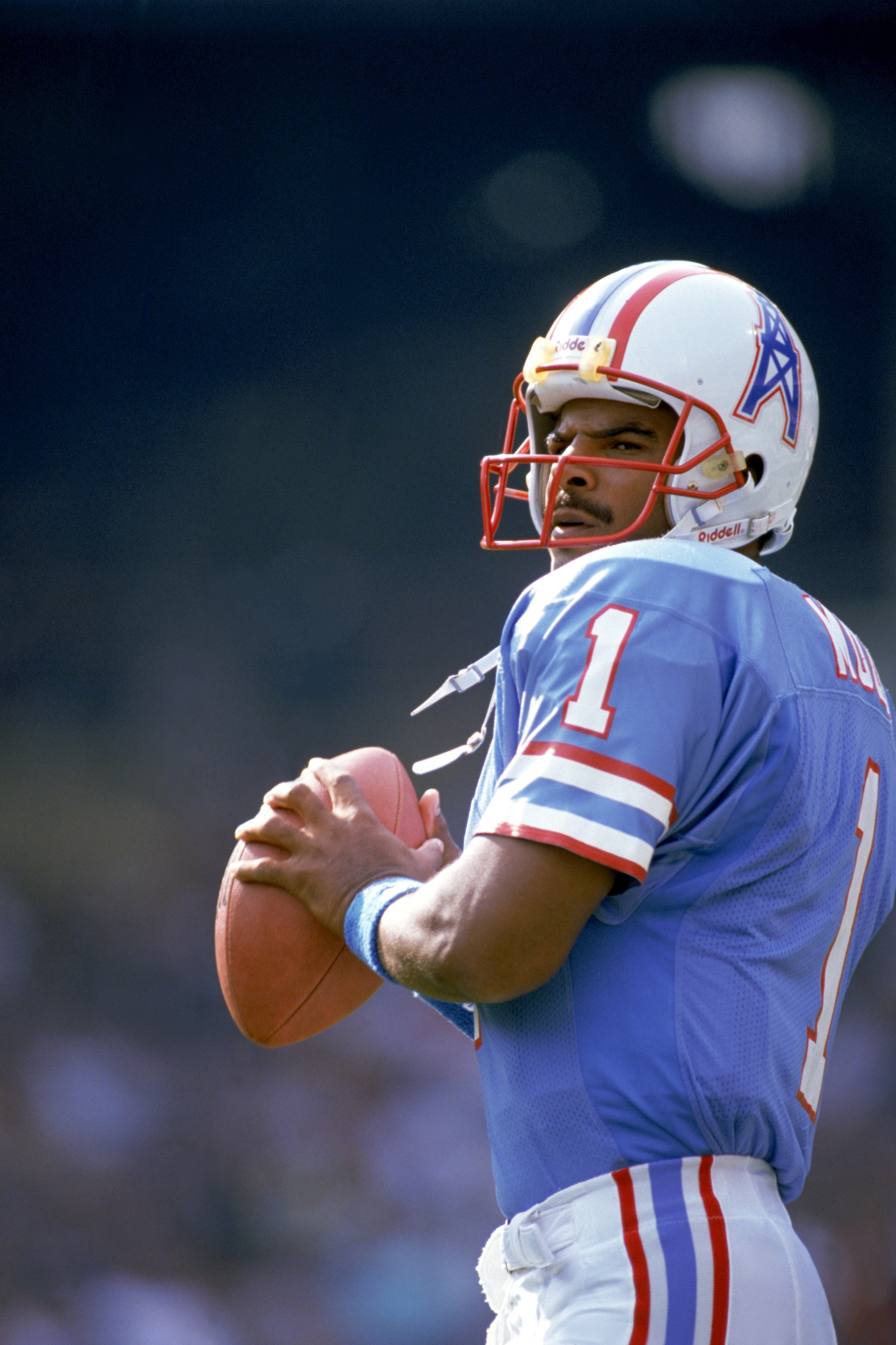 CLEVELAND - OCTOBER 29: Quarterback Warren Moon #1 of the Houston Oilers sets to pass during an NFL game against the Cleveland Browns at Cleveland Stadium on October 29, 1989 in Cleveland, Ohio. The Browns won 28-17. (Photo by Brian Masck/Getty Images) CLEVELAND - OCTOBER 29: Quarterback Warren Moon #1 of the Houston Oilers sets to pass during an NFL game against the Cleveland Browns at Cleveland Stadium on October 29, 1989 in Cleveland, Ohio. The Browns won 28-17. (Photo by Brian Masck/Getty Images)