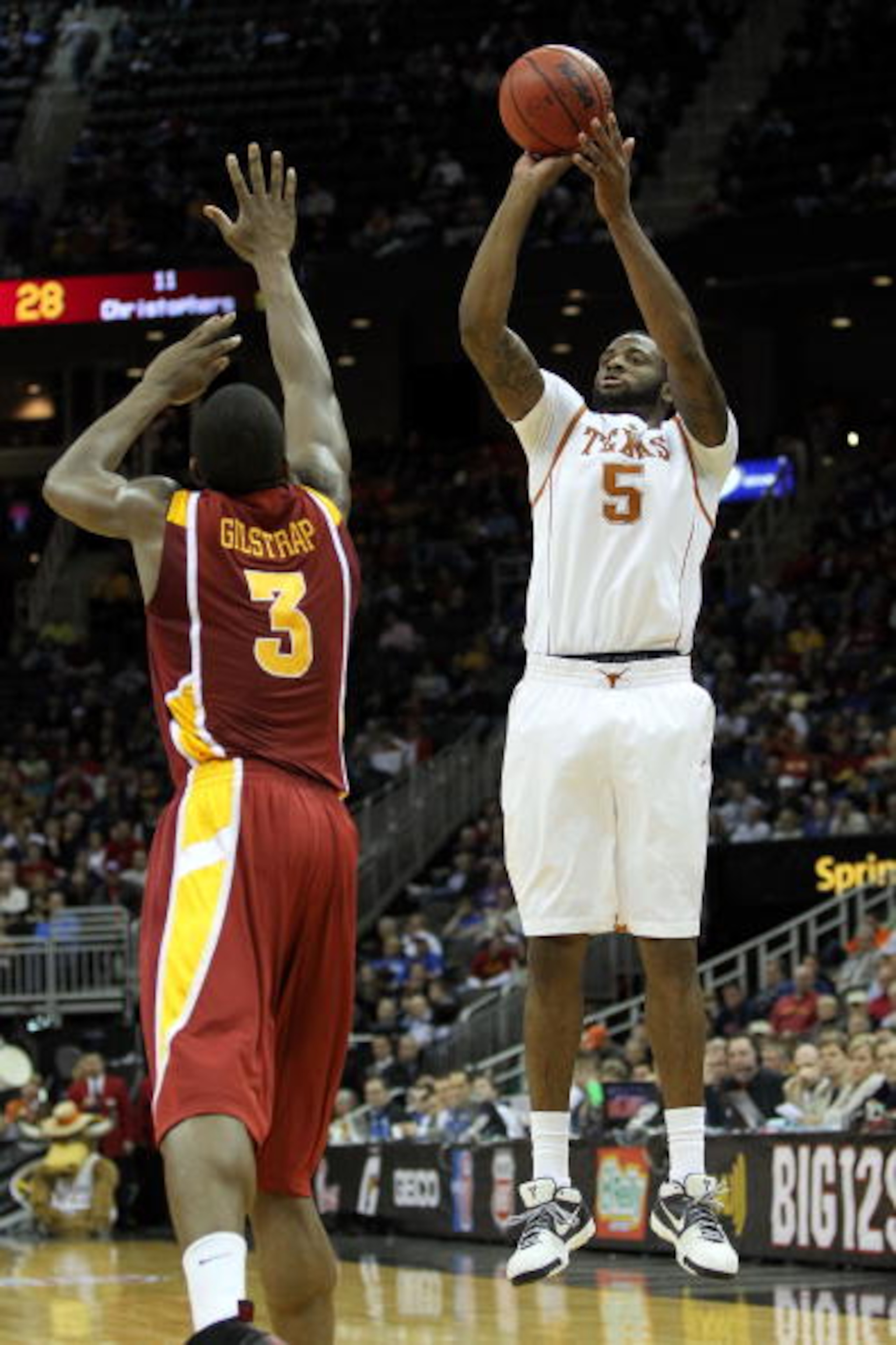 KANSAS CITY, MO - MARCH 10:  Damion James #5 of the Texas Longhorns shoots over Marquis Gilstrap #3 of the Iowa State Cyclones in the first half during the first round game of the 2010 Phillips 66 Big 12 Men's Basketball Tournament at the Sprint Center on
