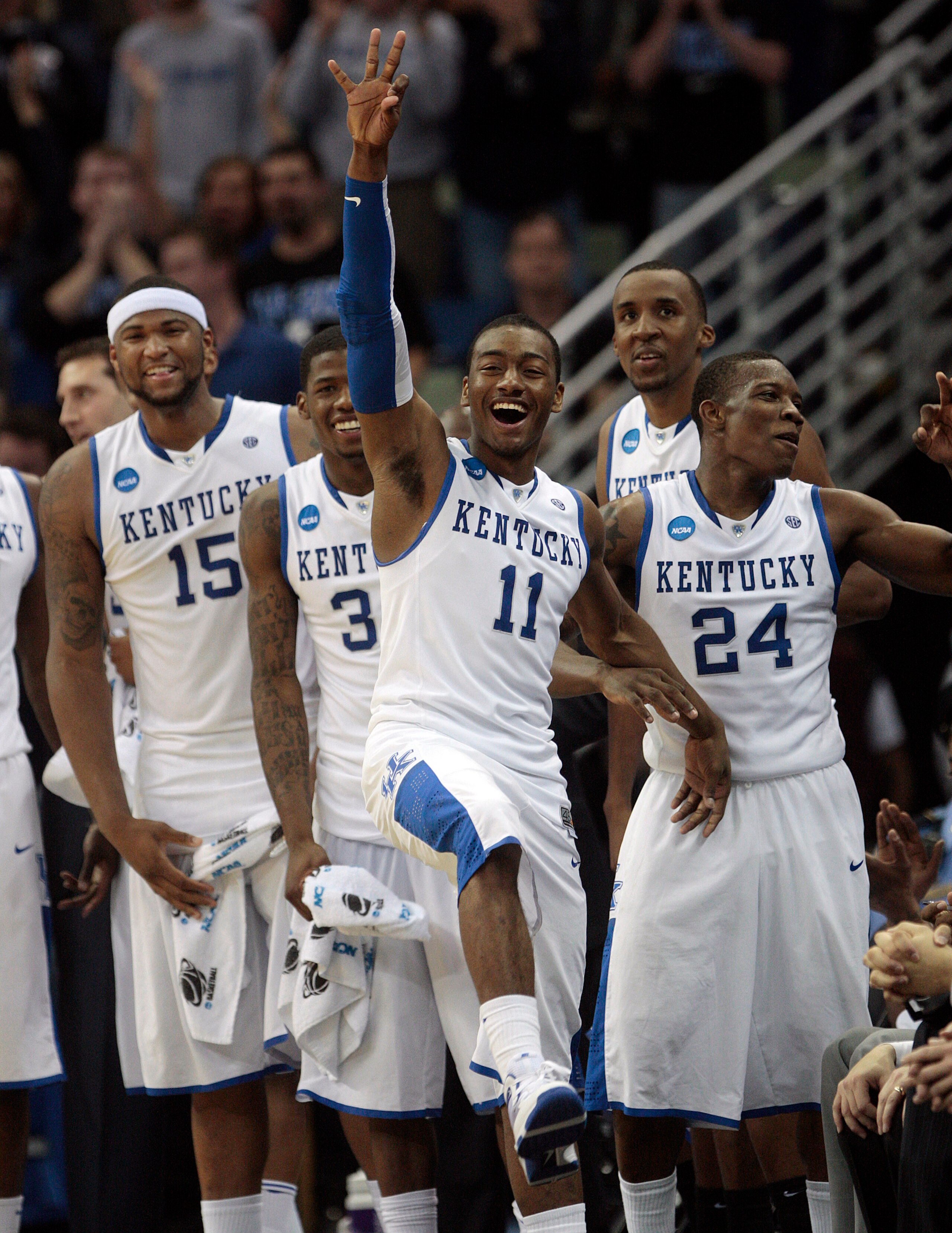 NEW ORLEANS - MARCH 20:  John Wall #11, Demarcus Cousins #15, DeAndre Liggins #34 and Eric Bledsoe #24 of the Kentucky Wildcats react to their 90-60 win over the Wake Forest Demon Deacons  during the second round of the 2010 NCAA men's basketball tourname