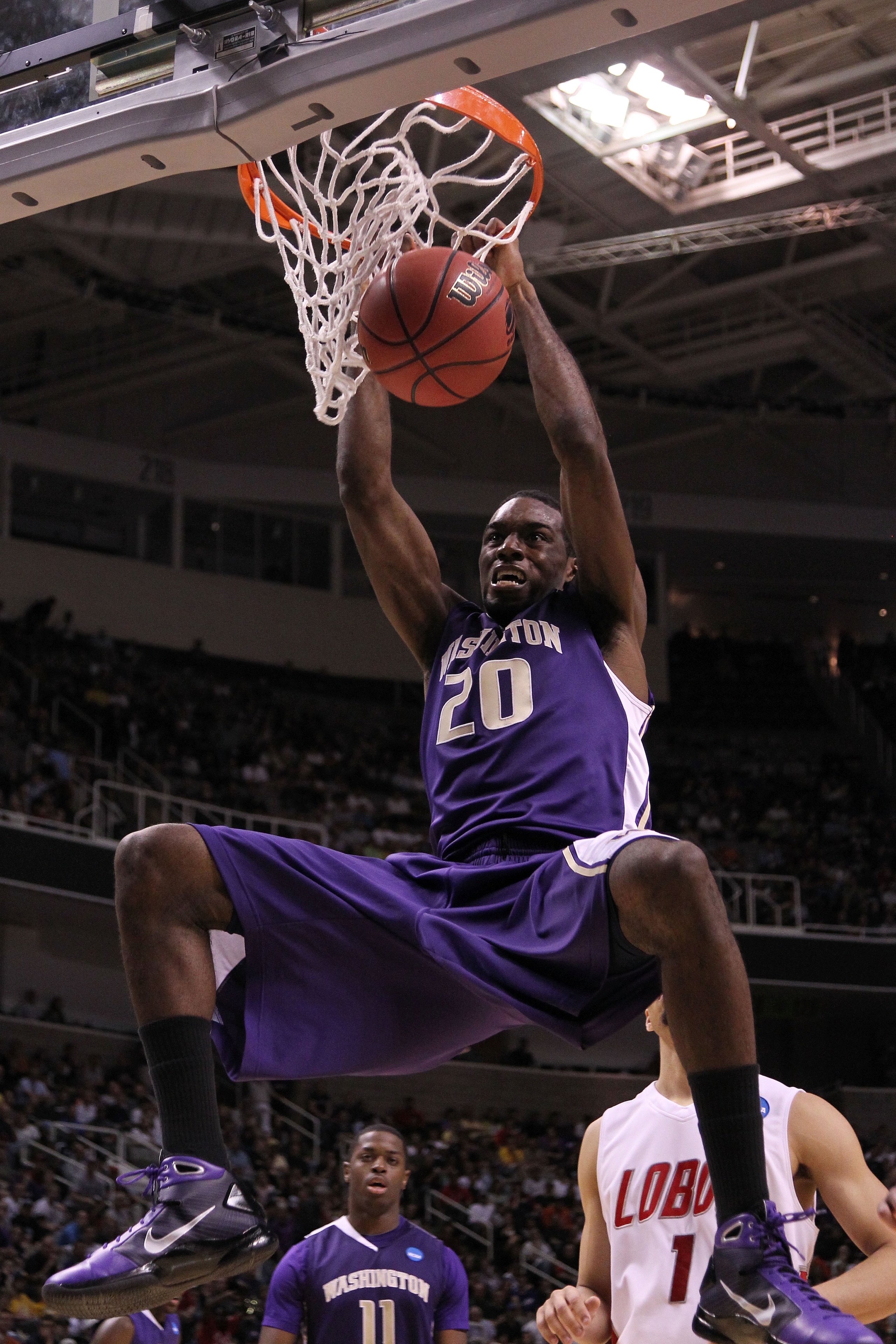 SAN JOSE, CA - MARCH 20:  Forward Quincy Pondexter #20 of the Washington Huskies dunks the ball against the New Mexico Lobos during the second round of the 2010 NCAA men's basketball tournament at HP Pavilion on March 20, 2010 in San Jose, California.  (P