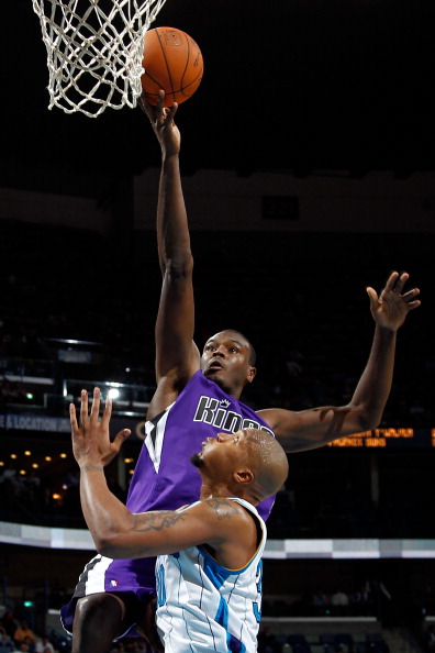 NEW ORLEANS, LA - DECEMBER 15:  Samuel Dalembert #10 of the Sacramento Kings shoots the ball over David West #30 of the New Orleans Hornets  at the New Orleans Arena on December 15, 2010 in New Orleans, Louisiana.  NOTE TO USER: User expressly acknowledge