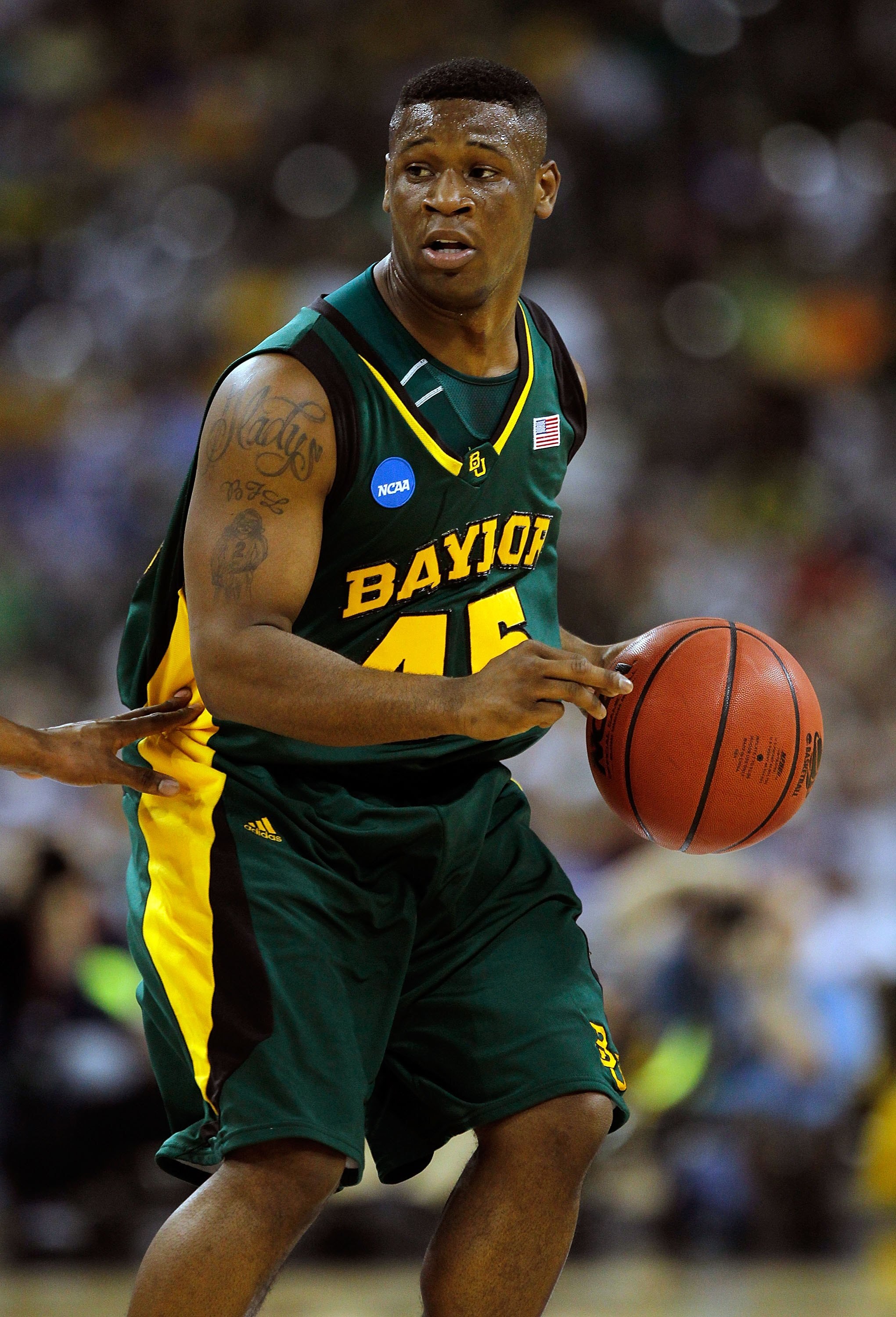 HOUSTON - MARCH 28: Tweety Carter #45 of the Baylor Bears brings the ball up court against the Duke Blue Devils during the south regional final of the 2010 NCAA men's basketball tournament at Reliant Stadium on March 28, 2010 in Houston, Texas. Duke defea