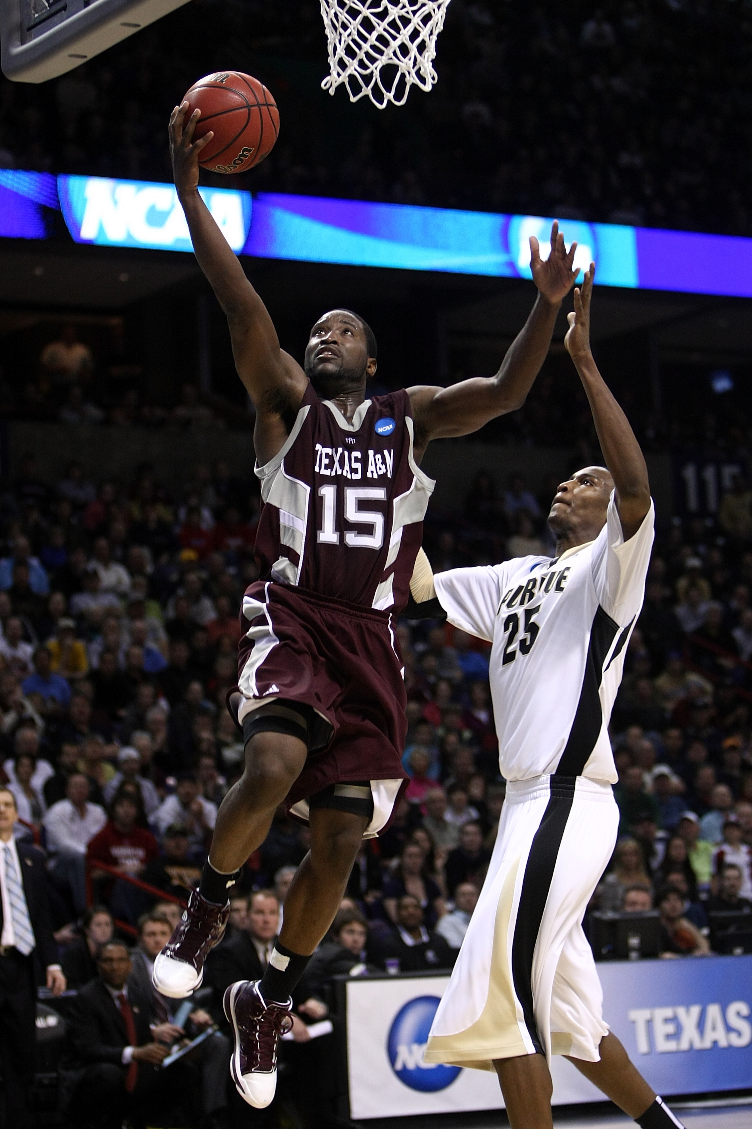 SPOKANE, WA - MARCH 21:  Donald Sloan #15 of the Texas A&M Aggies shoots against JaJuan Johnson #25the Purdue Boilermakers during the second round of the 2010 NCAA men's basketball tournament at Spokane Arena on March 21, 2010 in Spokane, Washington.  (Ph