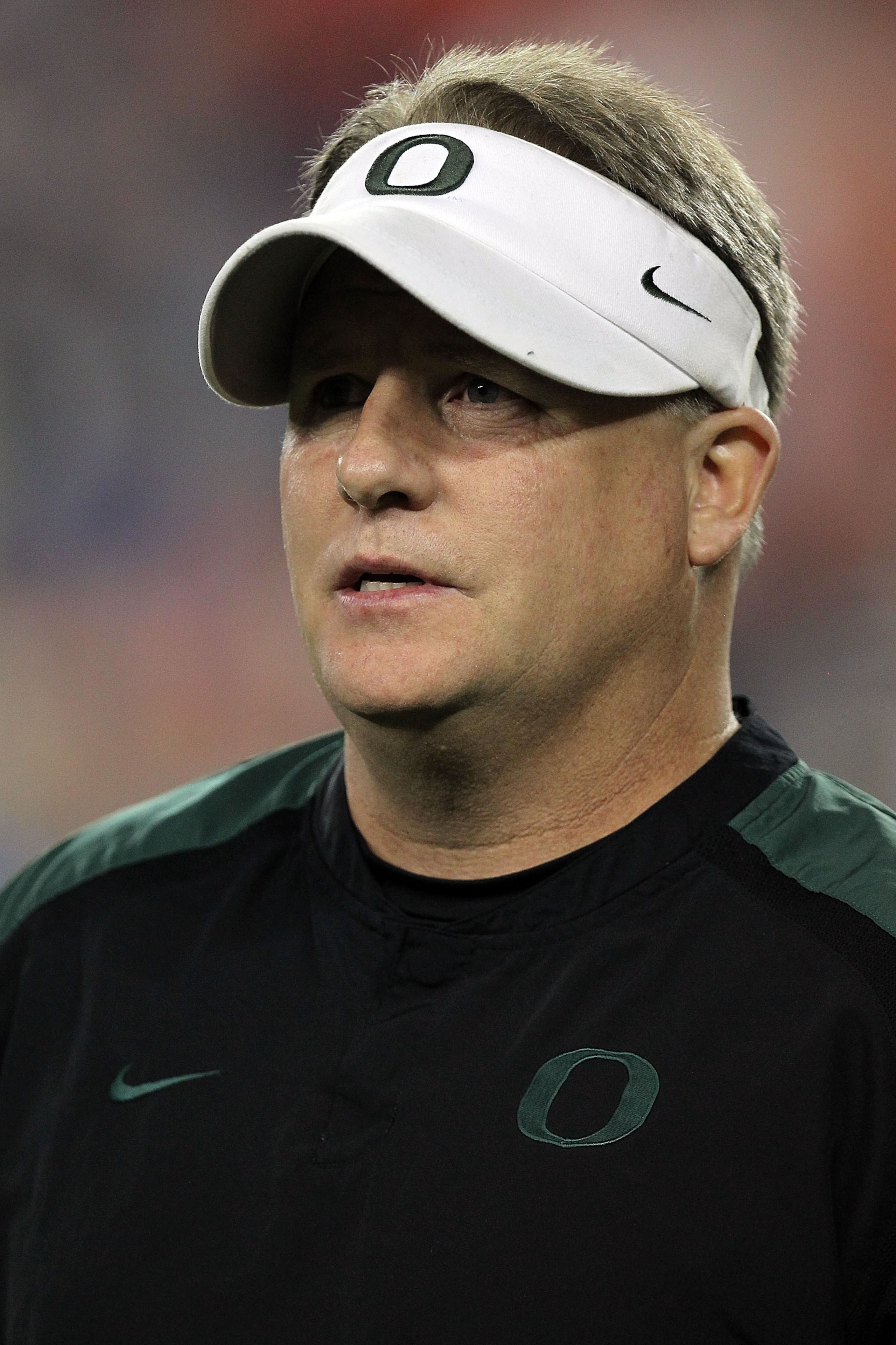 GLENDALE, AZ - JANUARY 10:  Head coach Chip Kelly of the Oregon Ducks looks on before taking on the Auburn Tigers in the Tostitos BCS National Championship Game at University of Phoenix Stadium on January 10, 2011 in Glendale, Arizona.  (Photo by Ronald M