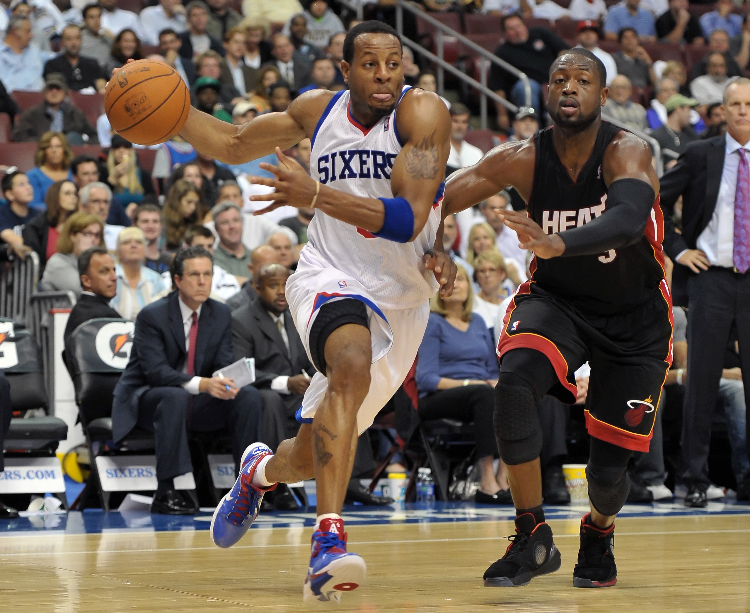 PHILADELPHIA - OCTOBER 27:  Andre Iguodala #9 of the Philadelphia 76ers drives past Dwyane Wade #3 of the Miami Heat at the Wells Fargo Center on October 27, 2010 in Philadelphia, Pennsylvania. NOTE TO USER: User expressly acknowledges and agrees that, by