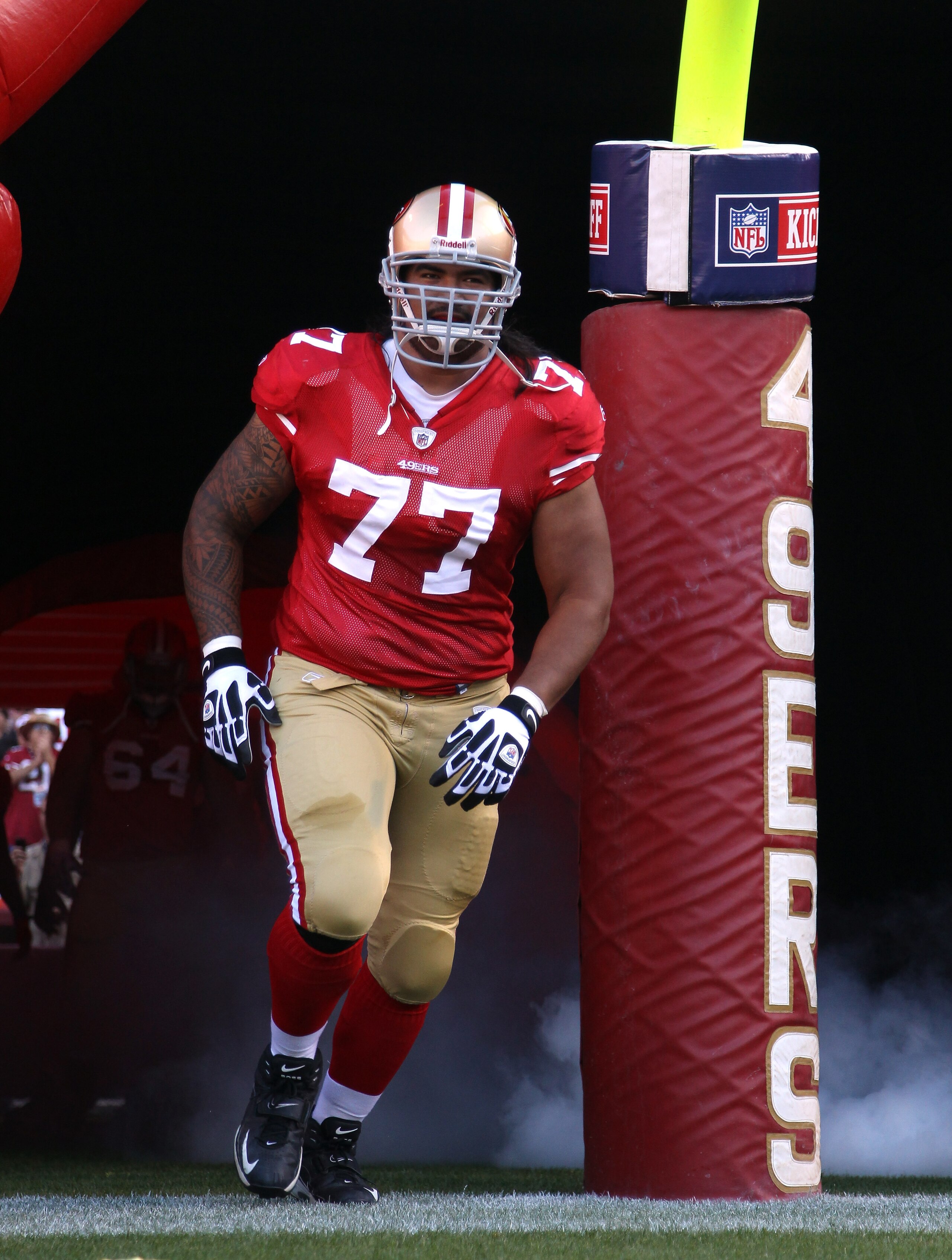 SAN FRANCISCO - SEPTEMBER 20:  Mike Iupati #77 of the San Francisco 49ers runs on to the field for their game against the New Orleans Saints at Candlestick Park on September 20, 2010 in San Francisco, California.  (Photo by Ezra Shaw/Getty Images)
