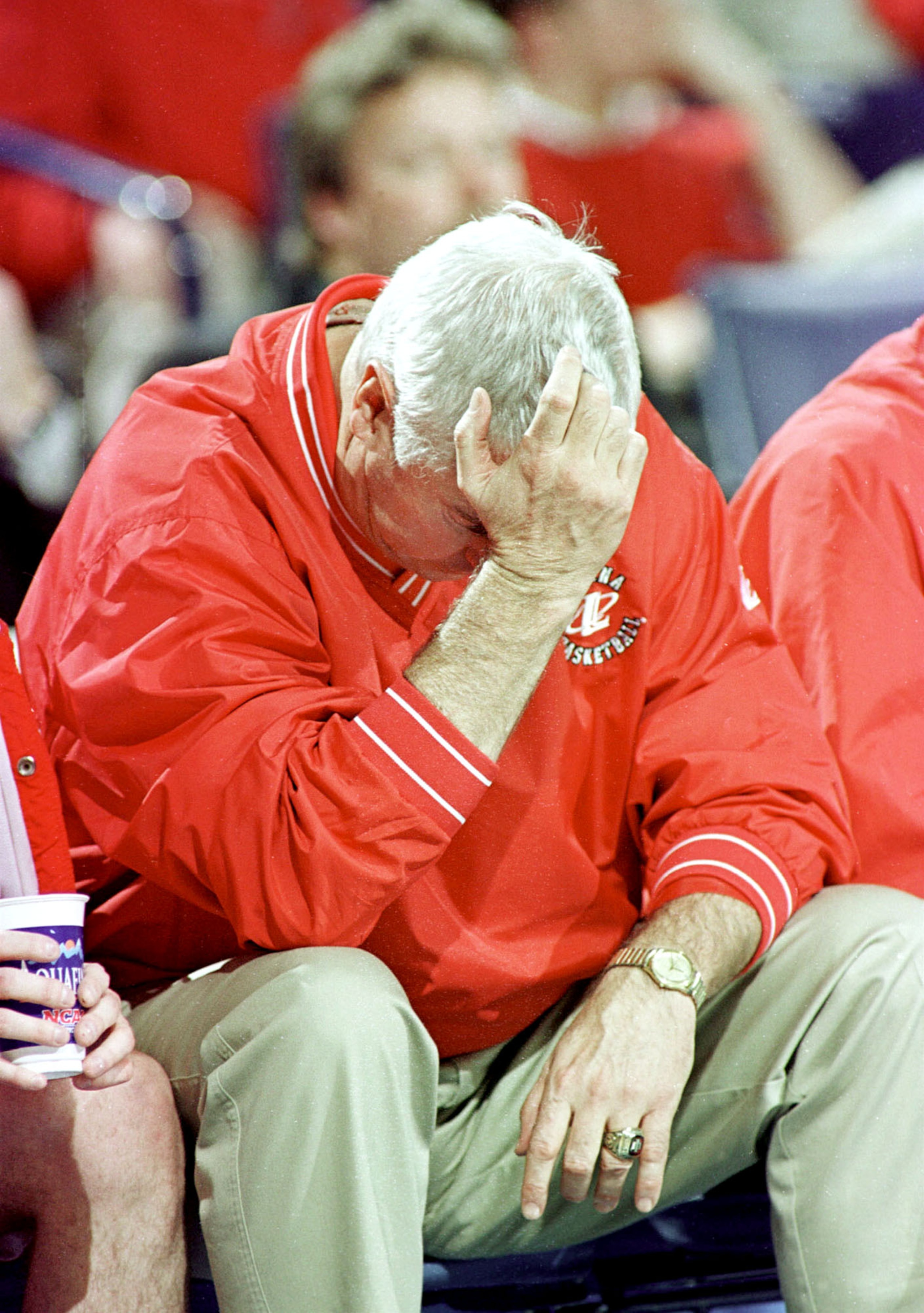 N366226 02: (NORTH AND SOUTH AMERICA SALES ONLY) FILE PHOTO: Indiana Coach Bobby Knight holds his head during a NCAA East Regional game March 17, 2000 in Buffalo, NY. After three decades, Knight's explosive temper may have engulfed his career as the contr