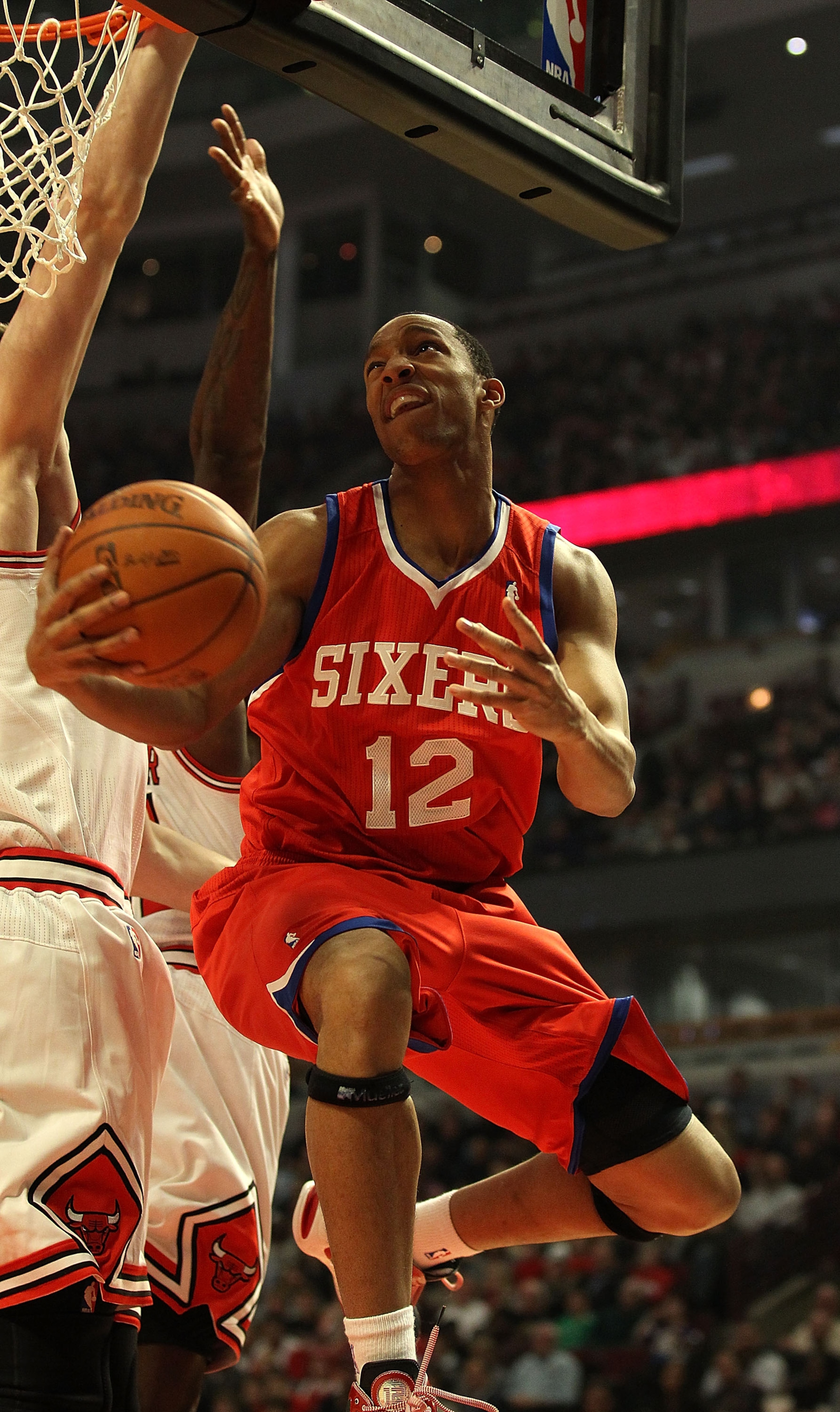 CHICAGO, IL - DECEMBER 21: Evan Turner #12 of the Philadelphia 76ers puts up a shot against the Chicago Bulls at the United Center on December 21, 2010 in Chicago, Illinois. NOTE TO USER: User expressly acknowledges and agrees that, by downloading and/or