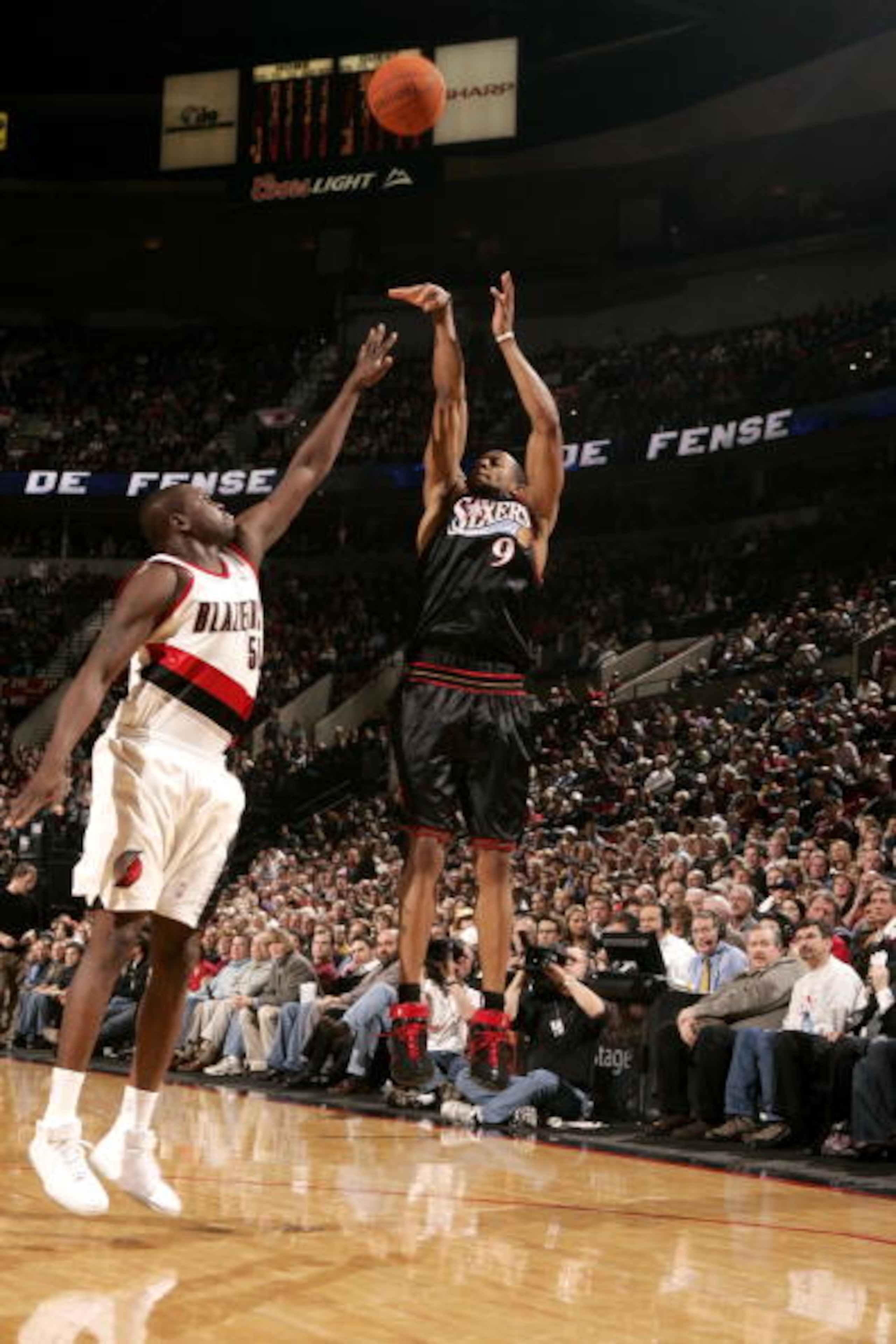PORTLAND, OR - DECEMBER 29:  Andre Iguodala #9 of the Philadelphia 76ers shoots over Zach Randolph #50 of the Portland Trail Blazers on December 29, 2006 at the Rose Garden in Portland, Oregon. The 76ers won 98-95. NOTE TO USER: User expressly acknowledge