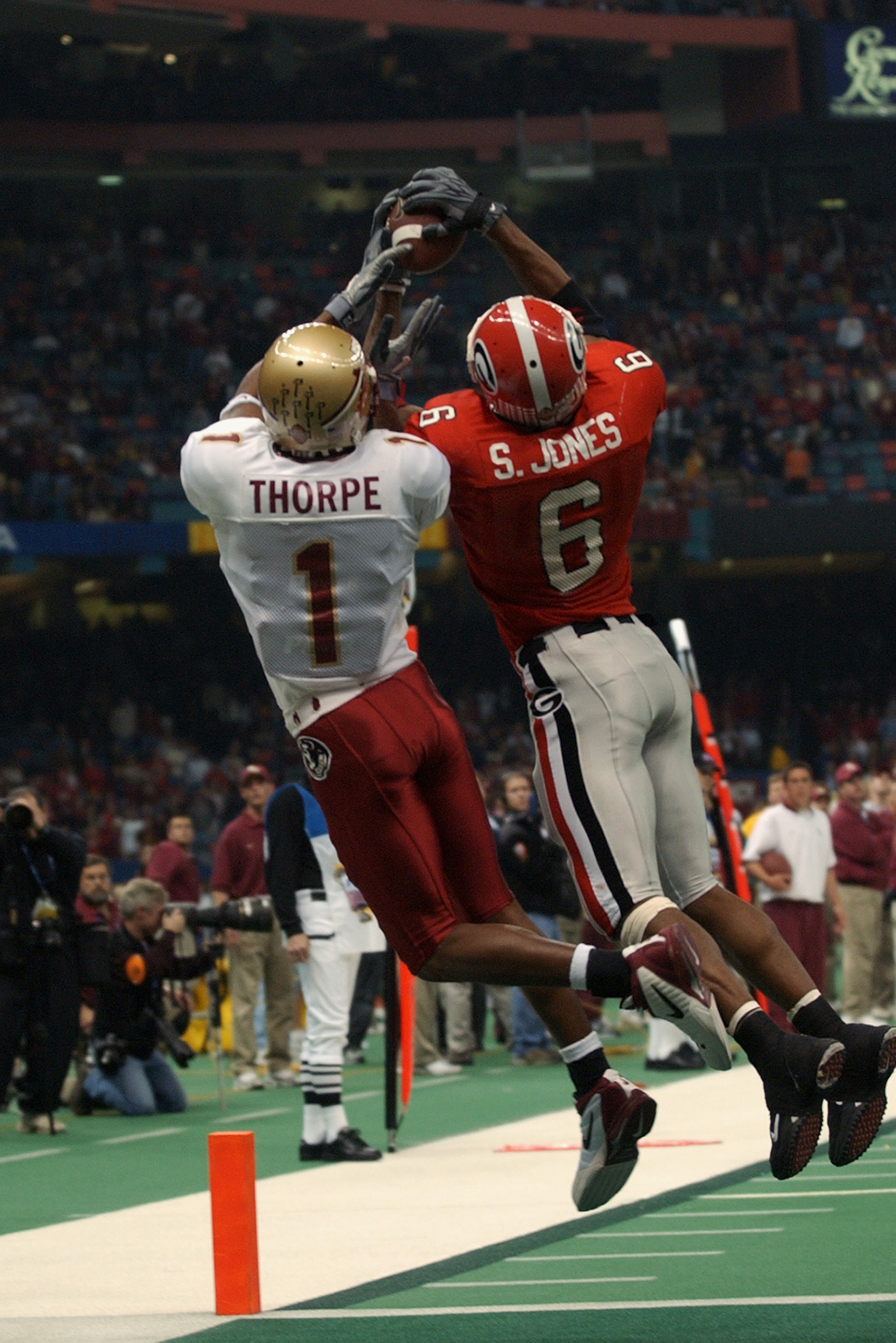 NEW ORLEANS - JANUARY 1:  Wide receiver Craphonso Thorpe #1 of the Florida State University Seminoles and free safety Sean Jones #6 of the University of Georgia Bulldogs attempt to catch a pass during the Nokia Sugar Bowl game at the Louisiana Superdome o