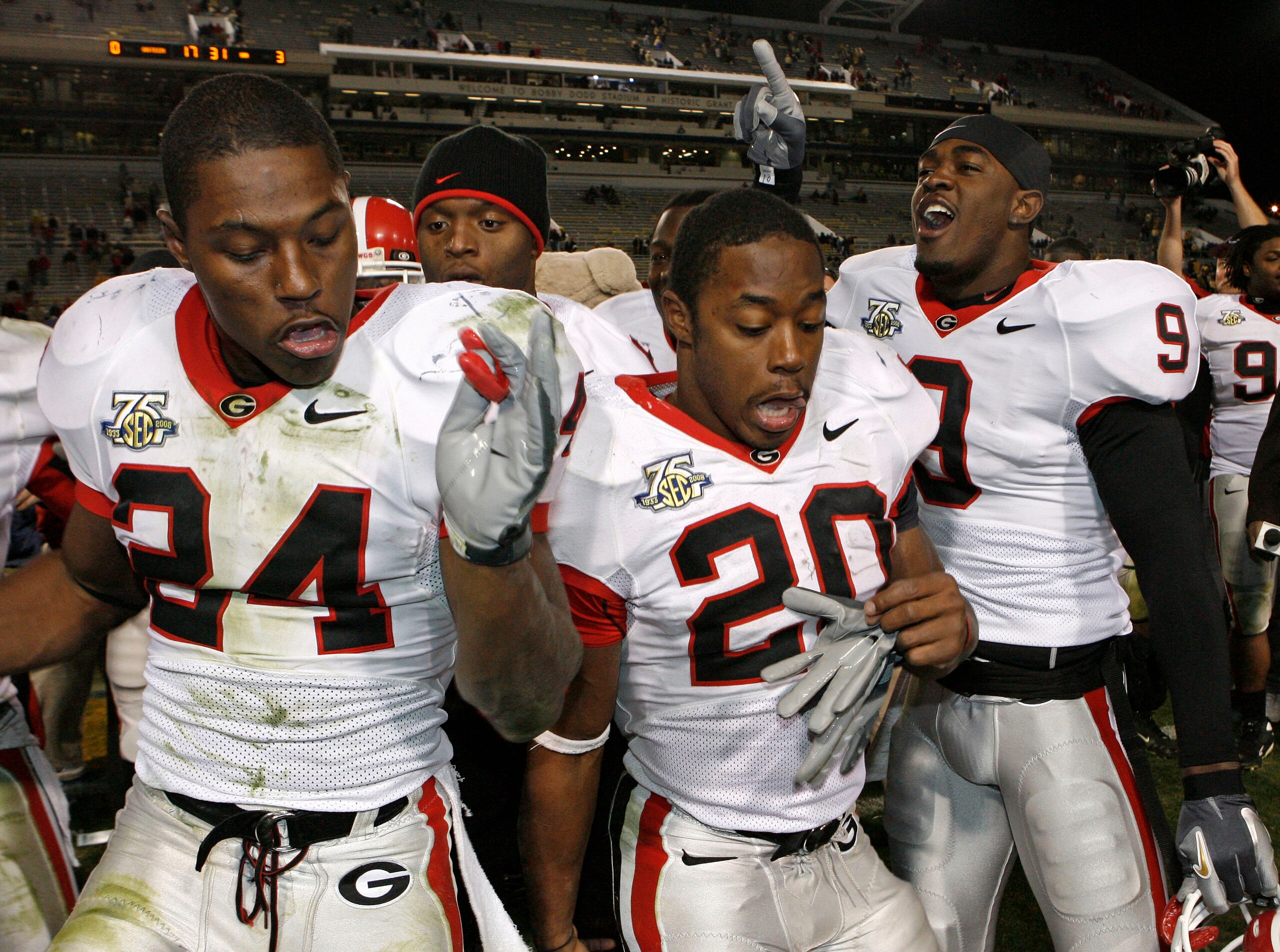 ATLANTA - NOVEMBER 24: Running back Knowshon Moreno #24, running back Thomas Brown #20 and safety Reshad Jones #9 of the Georgia Bulldogs celebrate after the game against the Georgia Tech Yellow Jackets on November 24, 2007 at Bobby Dodd Stadium at Histor