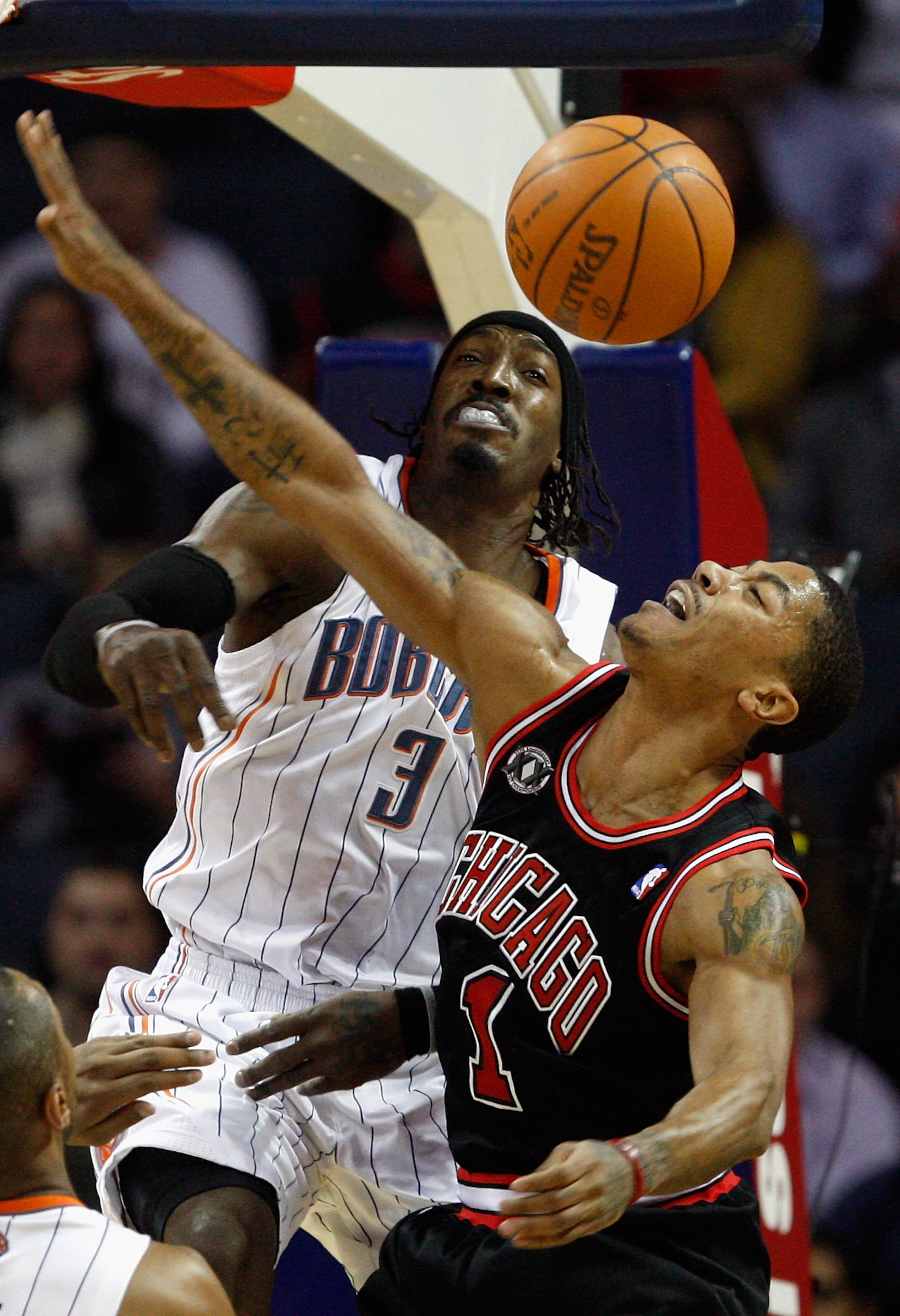 CHARLOTTE, NC - JANUARY 12:  Derrick Rose #1 of the Chicago Bulls has his shot blocked by Gerald Wallace #3 of the Charlotte Bobcats during their game at Time Warner Cable Arena on January 12, 2011 in Charlotte, North Carolina. NOTE TO USER: User expressl