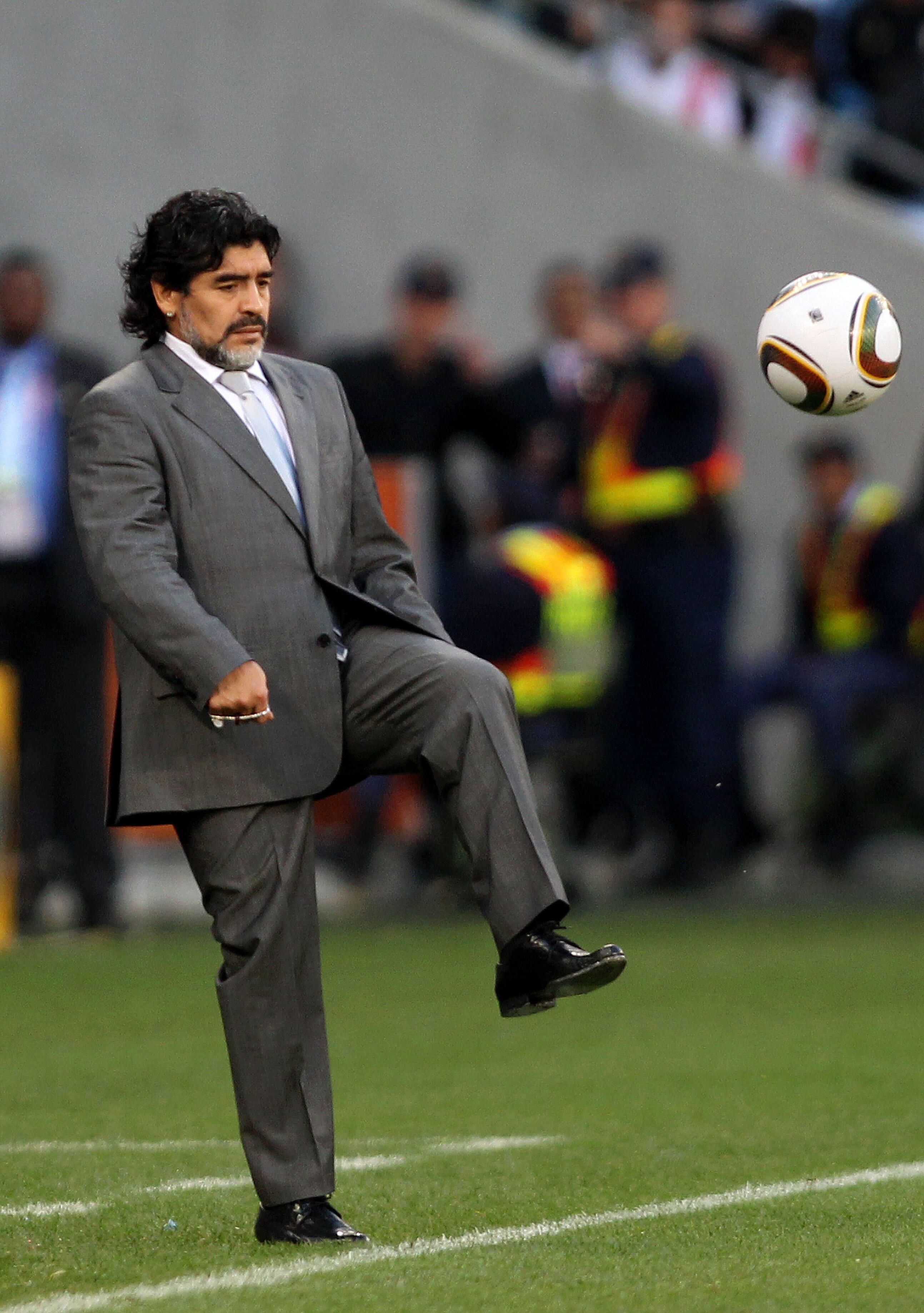 CAPE TOWN, SOUTH AFRICA - JULY 03:  Diego Maradona head coach of Argentina controls the ball on the touchline during the 2010 FIFA World Cup South Africa Quarter Final match between Argentina and Germany at Green Point Stadium on July 3, 2010 in Cape Town