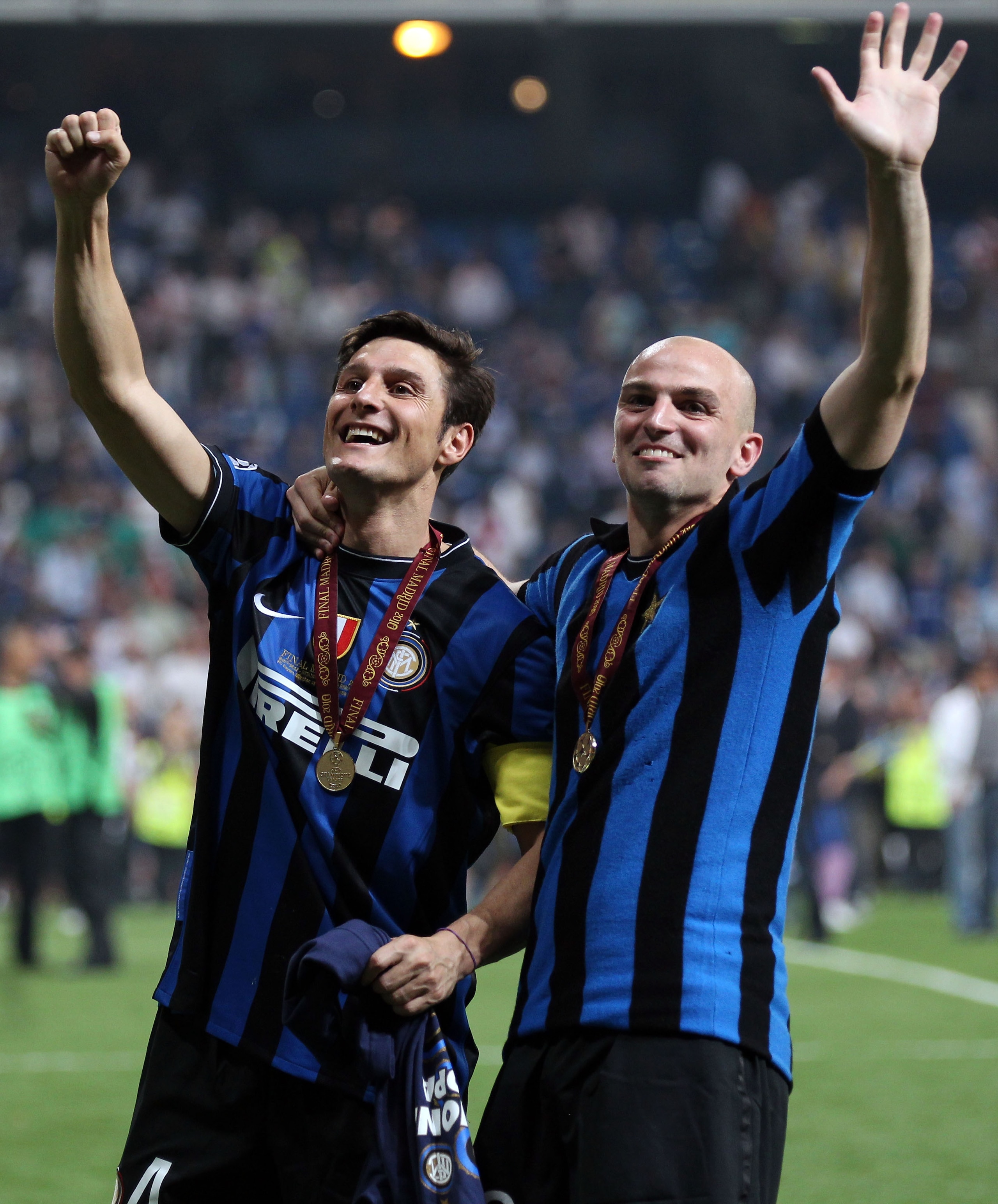 MADRID, SPAIN - MAY 22: Esteban Cambiasso (R) and Javier Zanetti of Inter Milan celebrate their team's victory at the end of the UEFA Champions League Final match between FC Bayern Muenchen and Inter Milan at the Estadio Santiago Bernabeu on May 22, 2010