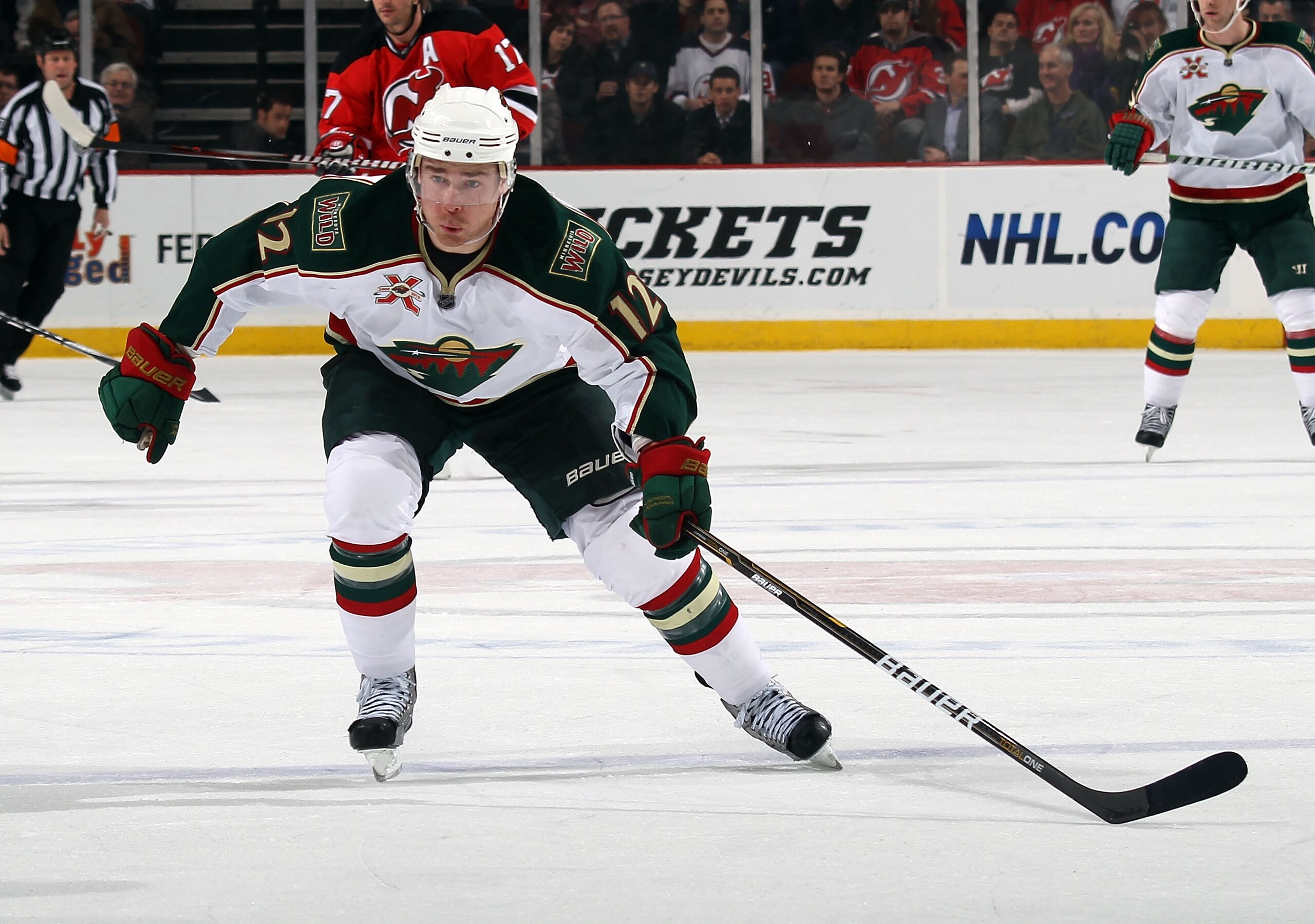 NEWARK, NJ - JANUARY 04:  Chuck Kobasew #12 of the Minnesota Wild skates against the New Jersey Devils at the Prudential Center on January 4, 2011 in Newark, New Jersey. The Wild defeated the Devils 2-1.  (Photo by Bruce Bennett/Getty Images)