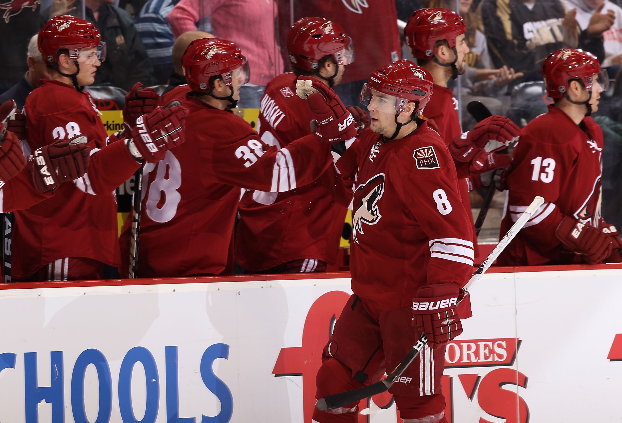 GLENDALE, AZ - DECEMBER 29:  Scottie Upshall #8 of the Phoenix Coyotes celebrates with teammates after scoring agianst the Los Angeles Kings during the NHL game at Jobing.com Arena on December 29, 2010 in Glendale, Arizona.  The Coyotes defeated the Kings