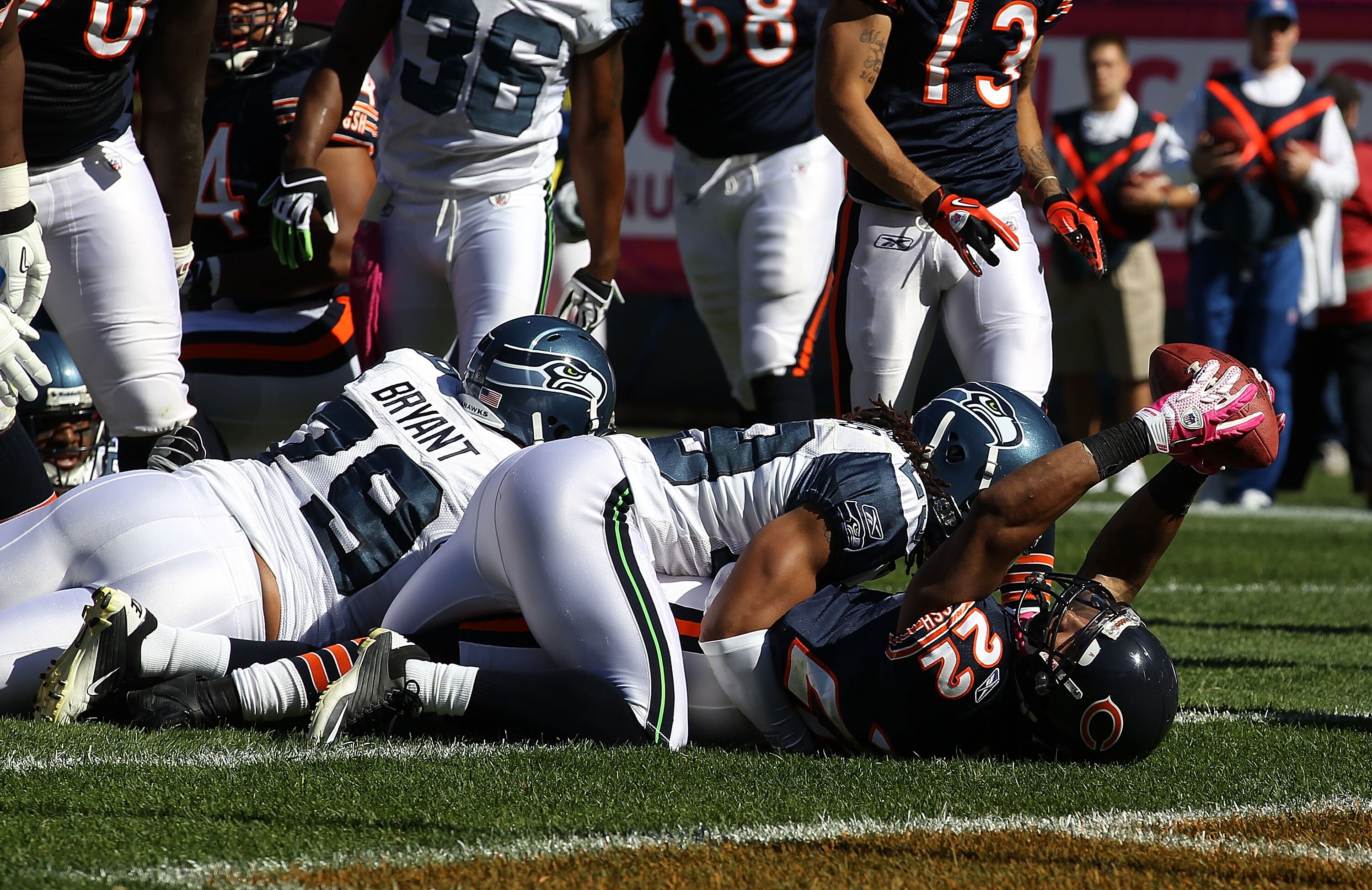 CHICAGO - OCTOBER 17: Matt Forte #22 of the Chicago Bears scores a touchdown as he is tackled by Earl Thomas #29 of the Seattle Seahawks at Soldier Field on October 17, 2010 in Chicago, Illinois. The Seahawks defeated the Bears 23-20. (Photo by Jonathan D