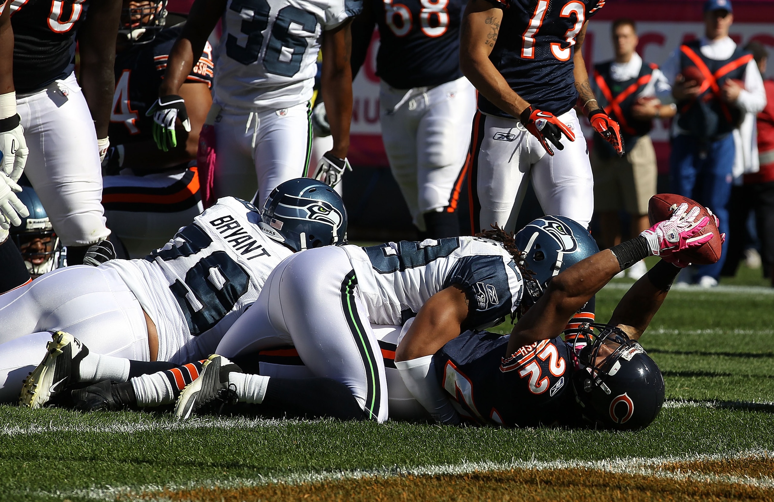 CHICAGO - OCTOBER 17: Matt Forte #22 of the Chicago Bears scores a touchdown as he is tackled by Earl Thomas #29 of the Seattle Seahawks at Soldier Field on October 17, 2010 in Chicago, Illinois. The Seahawks defeated the Bears 23-20. (Photo by Jonathan D