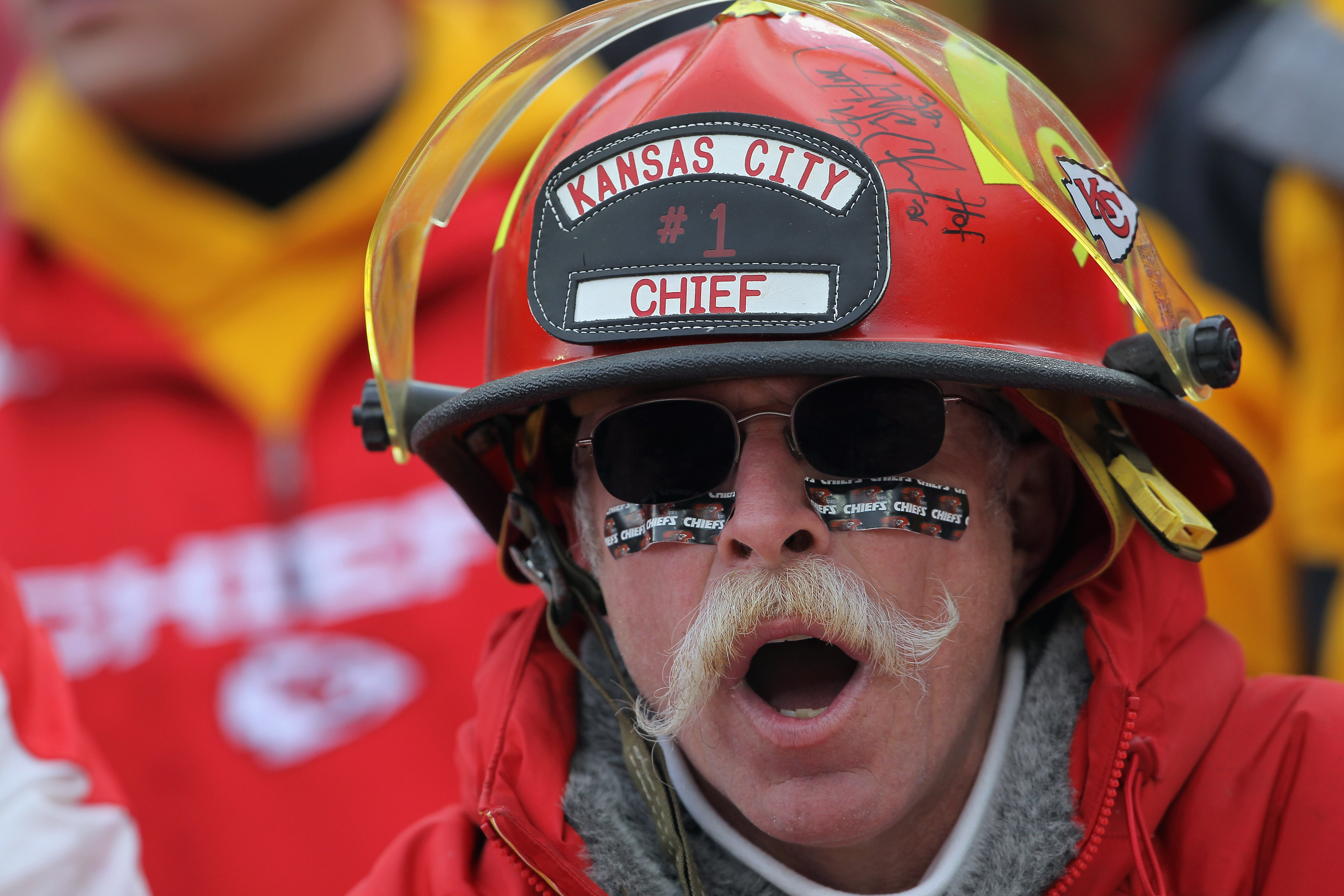 KANSAS CITY, MO - JANUARY 09:  A fan of the Kansas City Chiefs supports his team against the Baltimore Ravens as the Ravens defeated the Chiefs 30-7 in the 2011 AFC wild card playoff game at Arrowhead Stadium on January 9, 2011 in Kansas City, Missouri.  