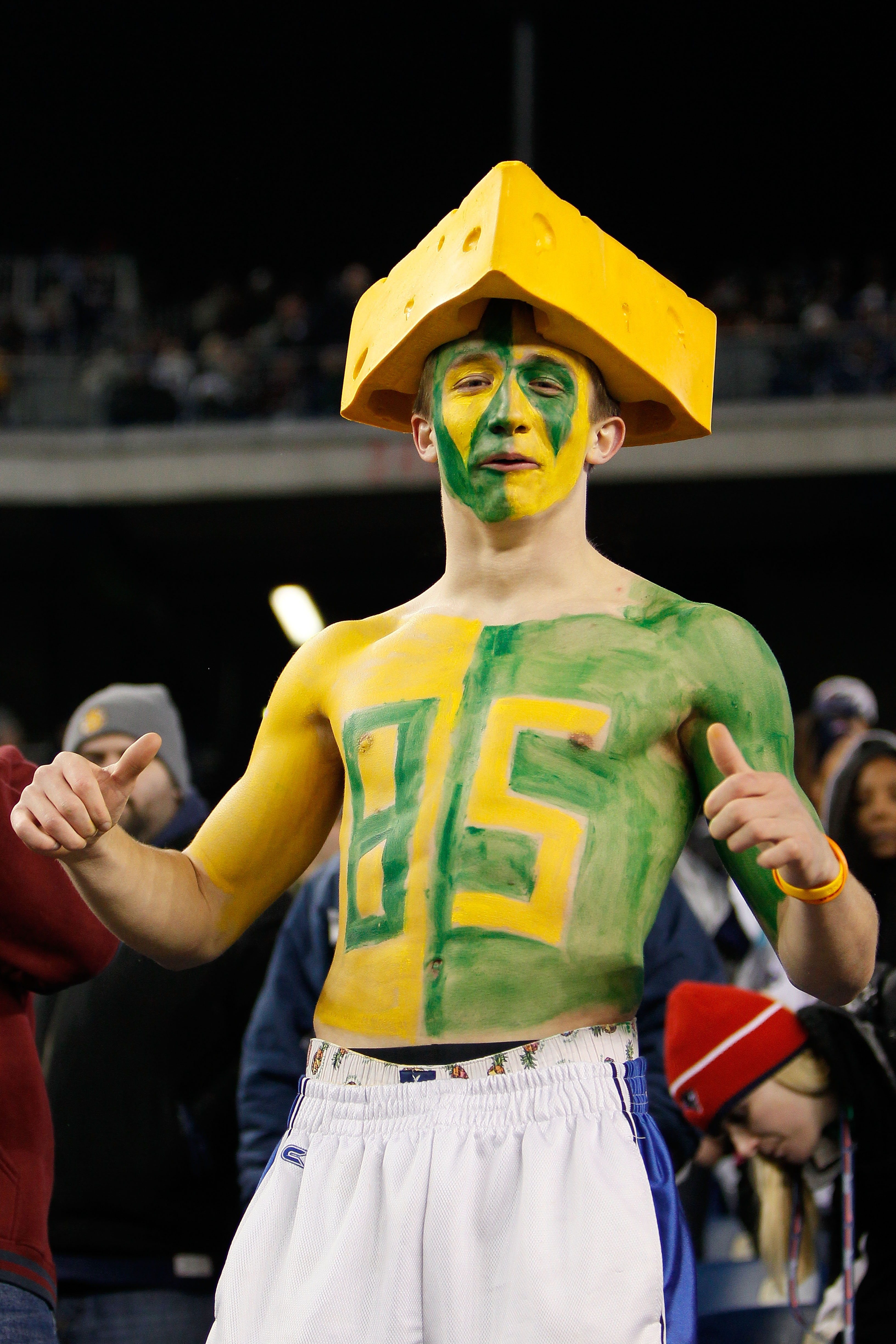 FOXBORO, MA - DECEMBER 19:  A fan of the Green Bay Packers cheers for the team prior to the start of the game against New England Patriots at Gillette Stadium on December 19, 2010 in Foxboro, Massachusetts.  (Photo by Jim Rogash/Getty Images)