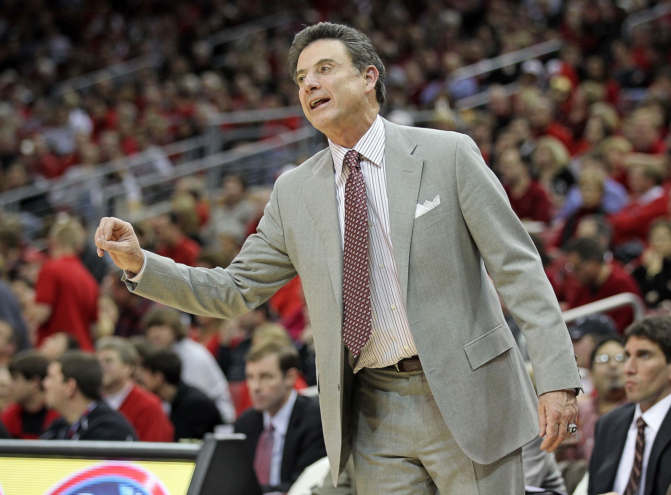 LOUISVILLE, KY - NOVEMBER 27: Rick Pitino the Head Coach of the Louisville Cardinals gives instructions to his team during the game against the Marshall Thundering Herd at the KFC Yum! Center on November 27, 2010 in Louisville, Kentucky. Louisville won LOUISVILLE, KY - NOVEMBER 27: Rick Pitino the Head Coach of the Louisville Cardinals gives instructions to his team during the game against the Marshall Thundering Herd at the KFC Yum! Center on November 27, 2010 in Louisville, Kentucky. Louisville won