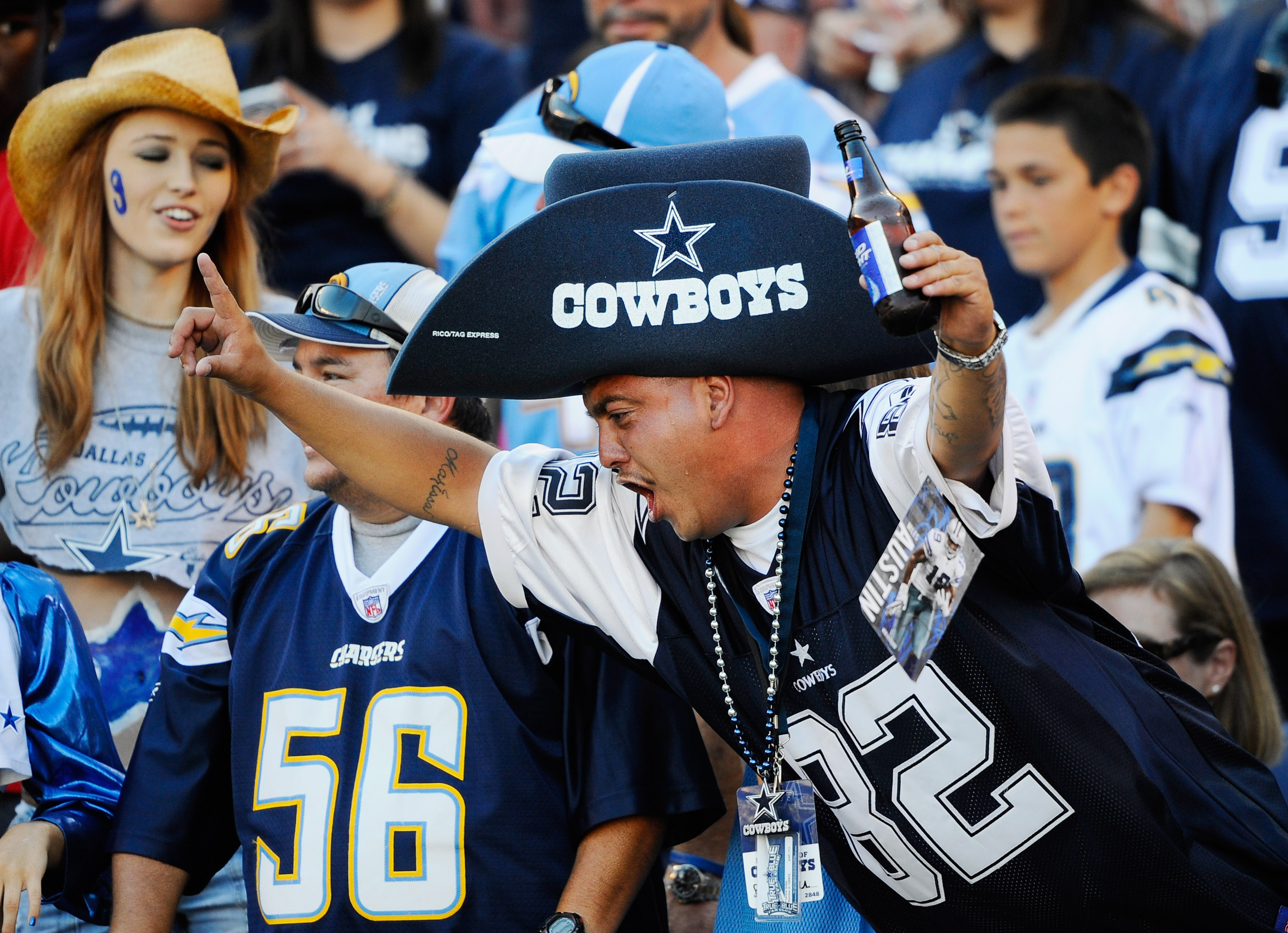 SAN DIEGO - AUGUST 21:  Fans of Dallas Cowboys cheer during the pre-season NFL football game against San Diego Chargers at Qualcomm Stadium on August 21, 2010 in San Diego, California.  (Photo by Kevork Djansezian/Getty Images)