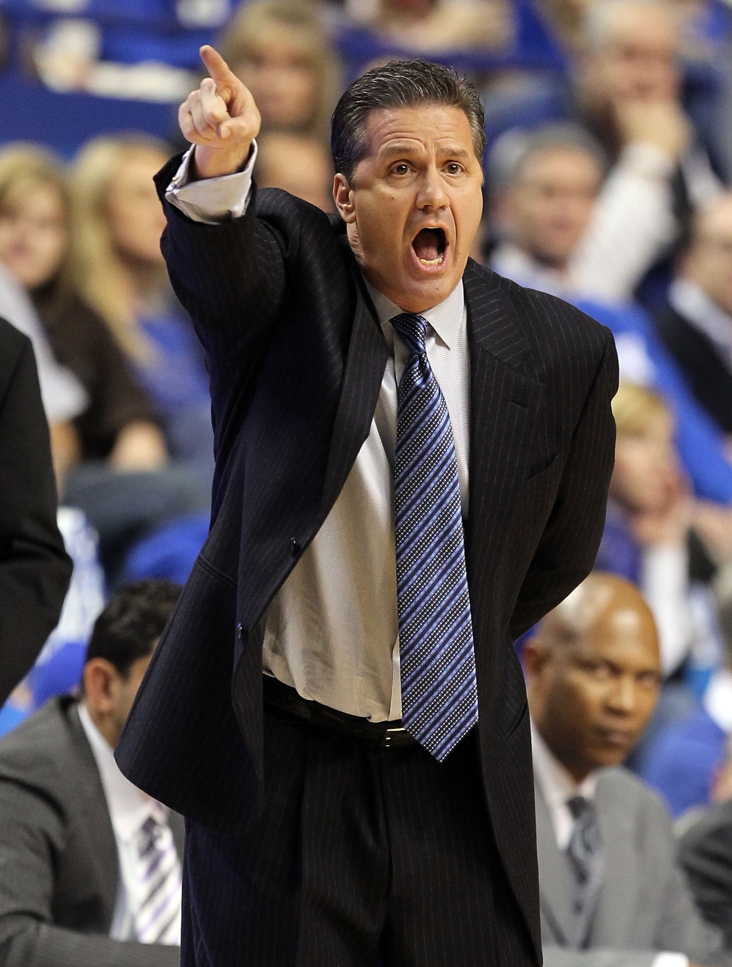 LEXINGTON, KY - JANUARY 03: John Calipari the Head Coach of the Kentucky Wildcats gives instructions to his team during the game against the Penn Quakers at Rupp Arena on January 3, 2011 in Lexington, Kentucky. Kentucky won 86-62. (Photo by Andy Lyons/ LEXINGTON, KY - JANUARY 03: John Calipari the Head Coach of the Kentucky Wildcats gives instructions to his team during the game against the Penn Quakers at Rupp Arena on January 3, 2011 in Lexington, Kentucky. Kentucky won 86-62. (Photo by Andy Lyons/
