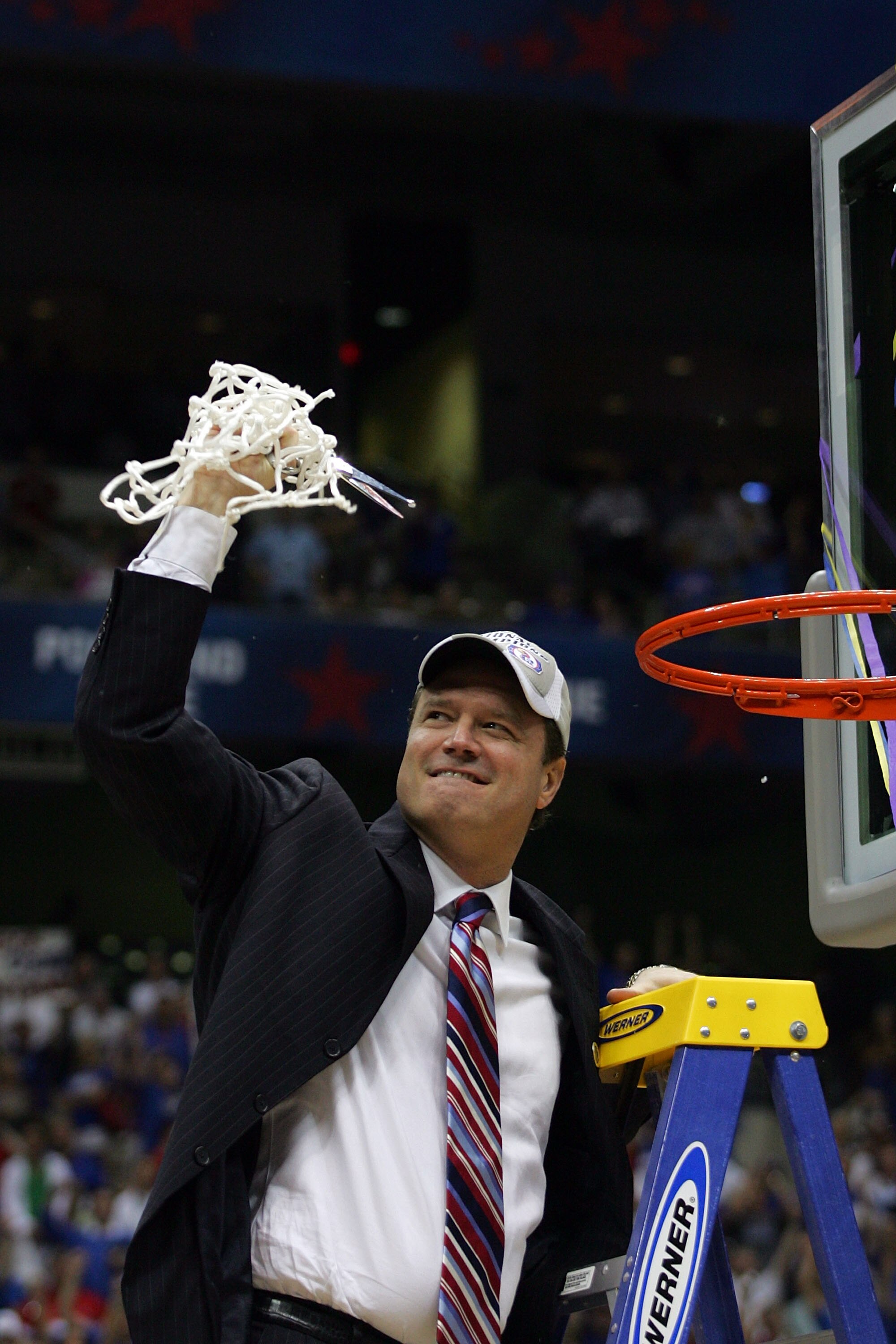 SAN ANTONIO - APRIL 07:  Head coach Bill Self of the Kansas Jayhawks celebrates by cutting down the nets after defeating the Memphis Tigers 75-68 in overtime during the 2008 NCAA Men's National Championship game at the Alamodome on April 7, 2008 in San An