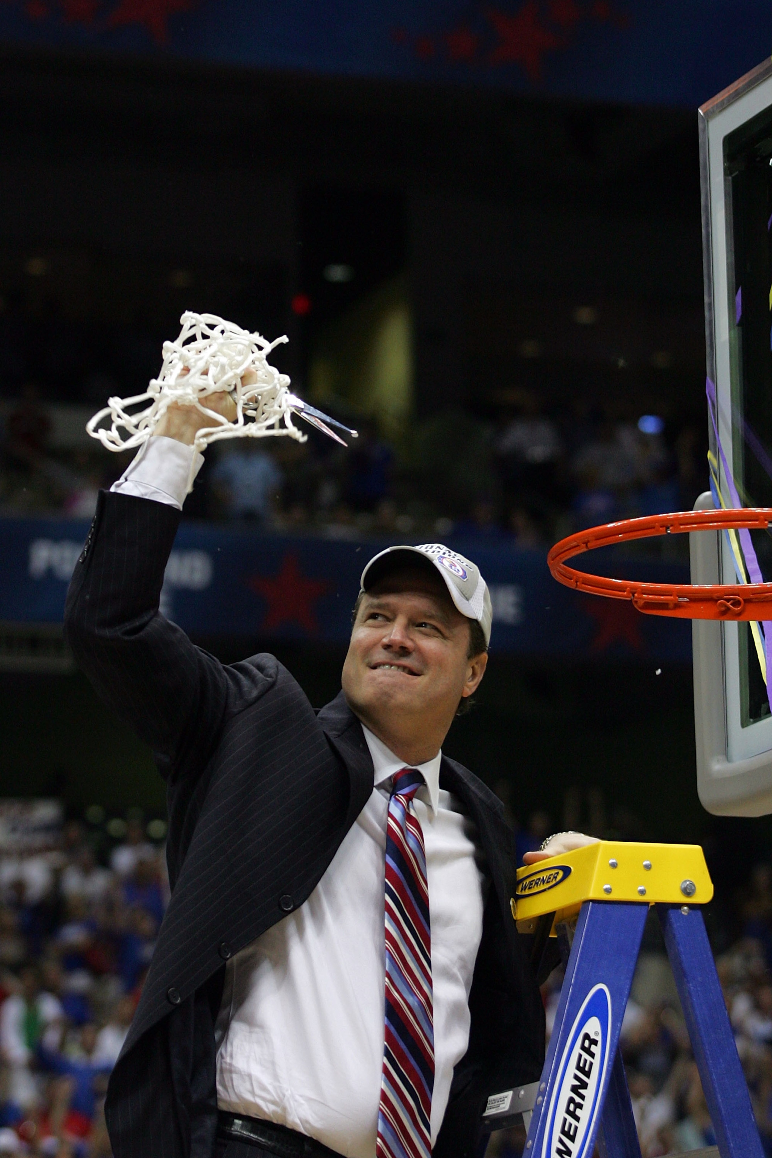 SAN ANTONIO - APRIL 07: Head coach Bill Self of the Kansas Jayhawks celebrates by cutting down the nets after defeating the Memphis Tigers 75-68 in overtime during the 2008 NCAA Men's National Championship game at the Alamodome on April 7, 2008 in San An SAN ANTONIO - APRIL 07: Head coach Bill Self of the Kansas Jayhawks celebrates by cutting down the nets after defeating the Memphis Tigers 75-68 in overtime during the 2008 NCAA Men's National Championship game at the Alamodome on April 7, 2008 in San An