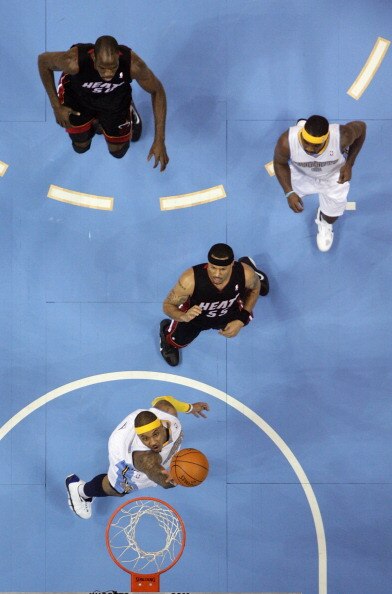DENVER, CO - JANUARY 13:  Carmelo Anthony #15 of the Denver Nuggets lays up a shot in front of Eddie House #55 of the Miami Heat as Ty Lawson #3 of the Nuggets and Joel Anthony #50 of the Heat follow the play at the Pepsi Center on January 13, 2011 in Den