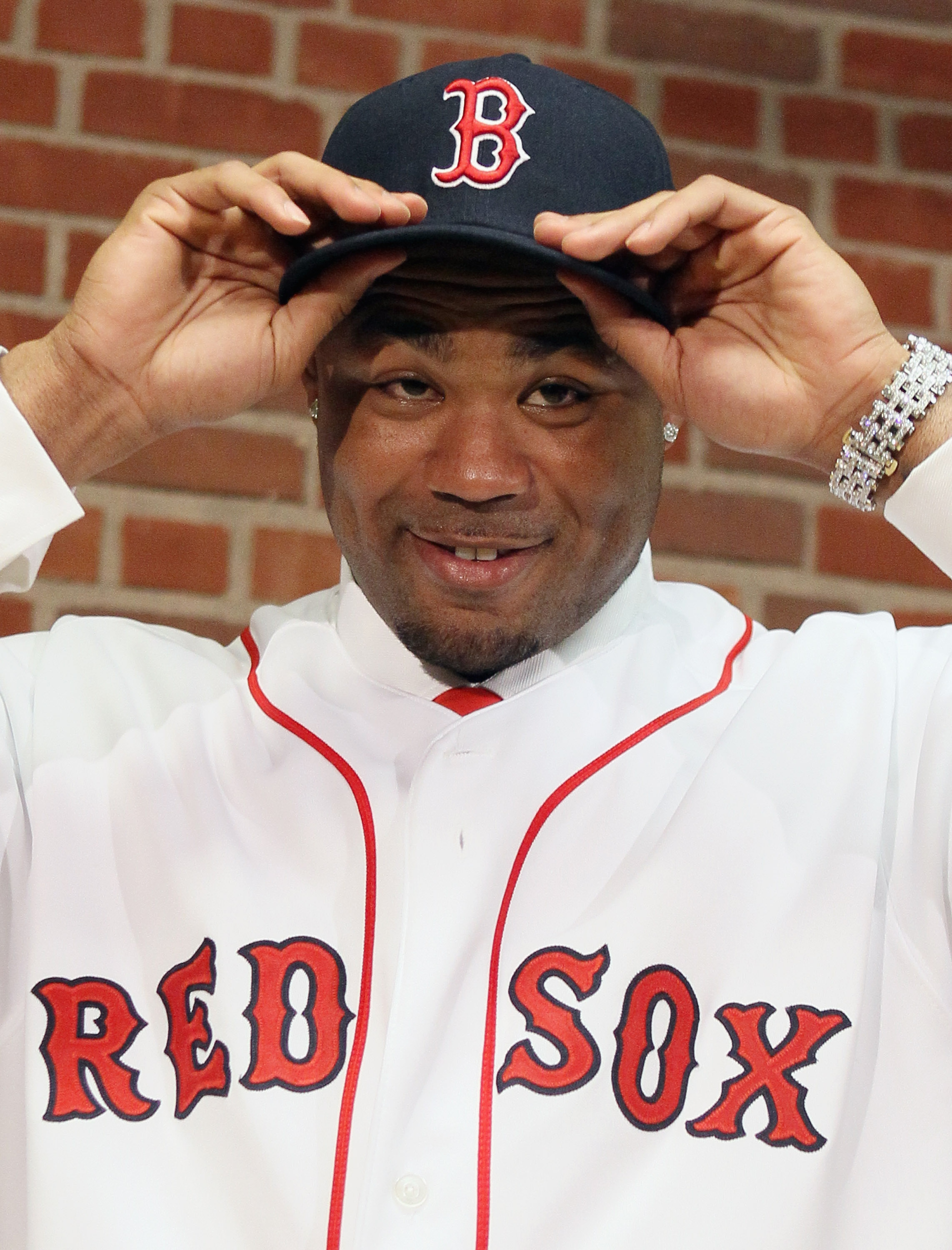 BOSTON, MA - DECEMBER 11:  Carl Crawford answers questions during a press conference announcing his signing with the Boston Red Sox on December 11,  2010 at the Fenway Park in Boston, Massachusetts.  (Photo by Elsa/Getty Images)
