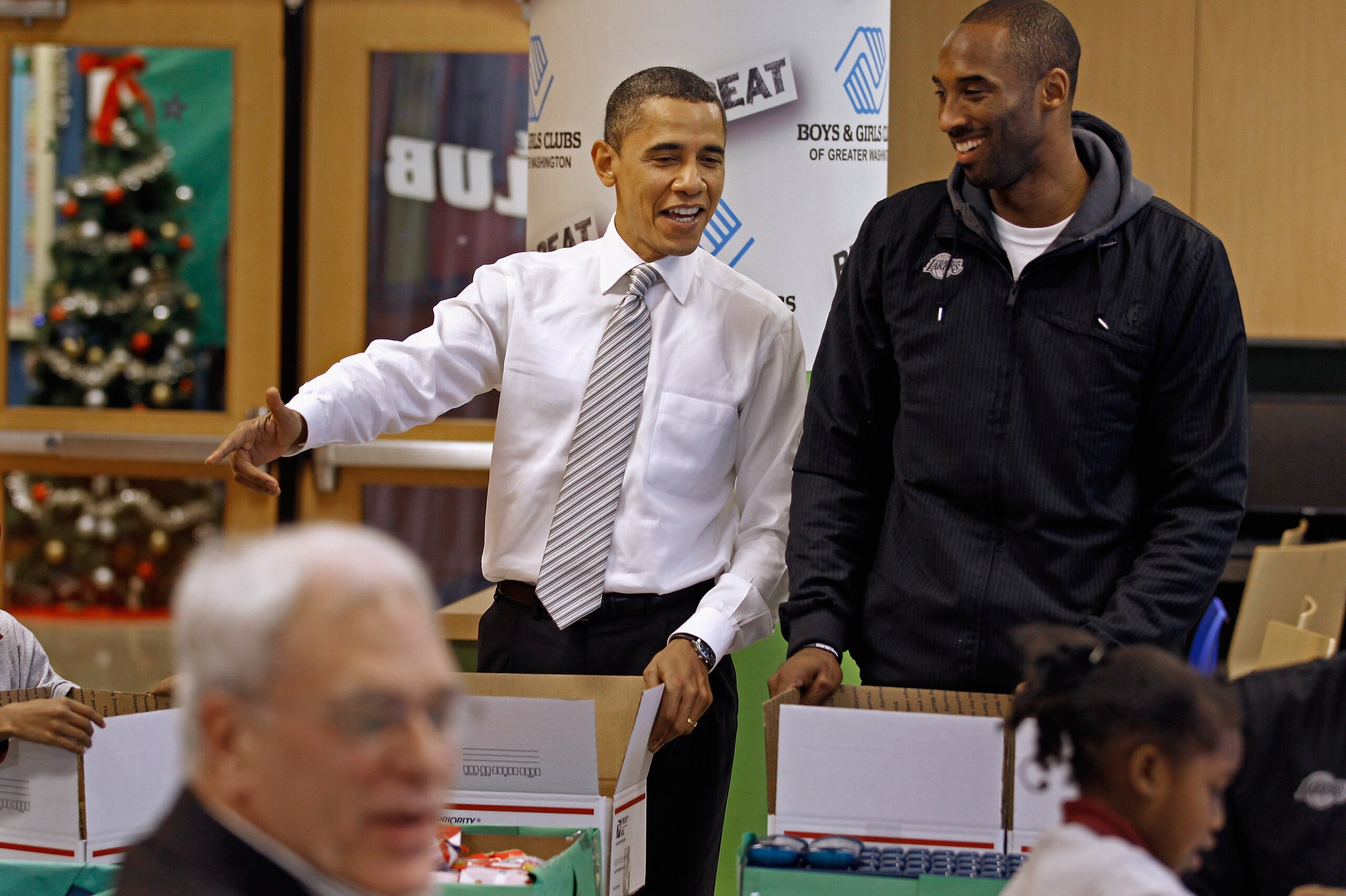 WASHINGTON, DC - DECEMBER 13:  (AFP OUT) U.S. President Barack Obama (L) talks with Kobe Bryant of the Los Angeles Lakers while filling care packages during a NBA Cares service event at the Boys and Girls Club at THEARC  December 13, 2010 in Washington, D