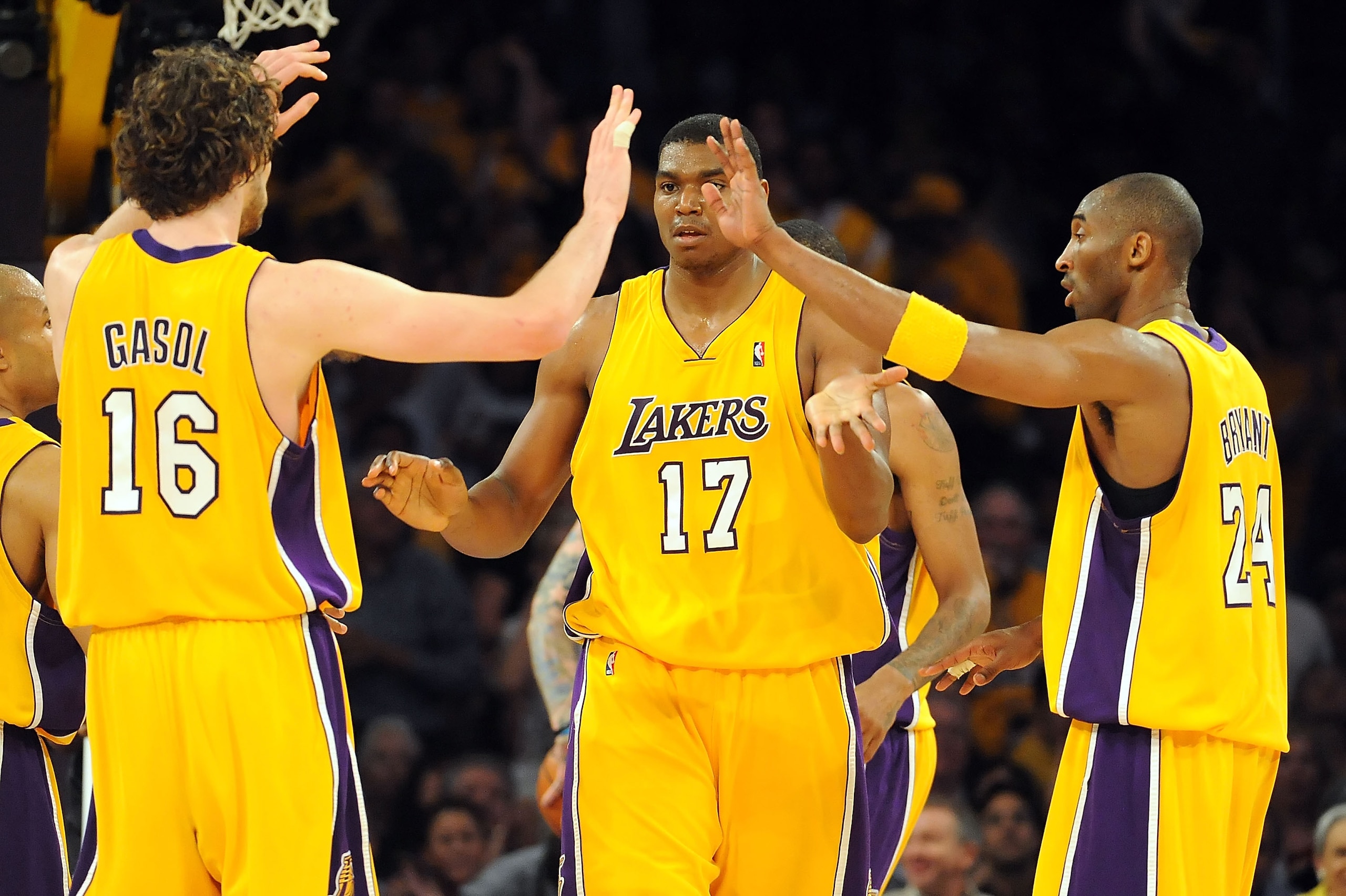 LOS ANGELES, CA - MAY 27:  (C) Andrew Bynum #17 of the Los Angeles Lakers gives teammates (L) Pau Gasol #16 and Kobe Bryant #24 of the Lakers a high five against the Denver Nuggets in the second quarter of Game Five of the Western Conference Finals during