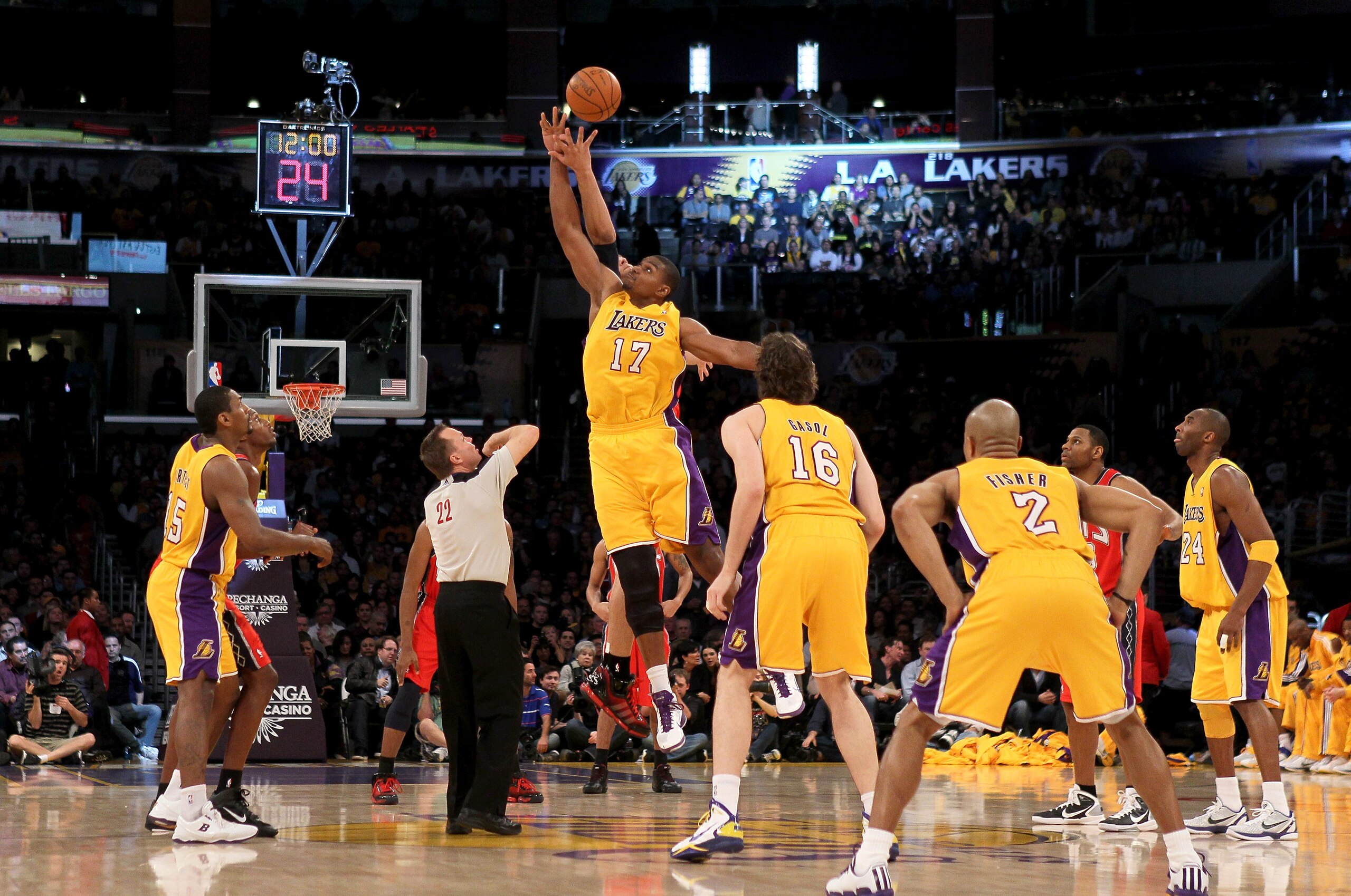 LOS ANGELES, CA - JANUARY 14:  Andrew Bynum #17 of the Los Angeles Lakers jumps for the ball on the opening tip off of the game with the New Jersey Nets at Staples Center on January 14, 2011 in Los Angeles, California. The Lakers won 100-88.  NOTE TO USER