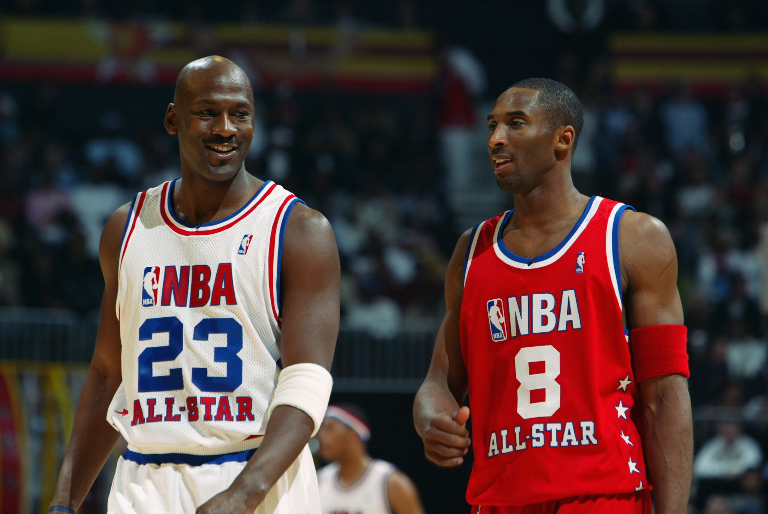 ATLANTA - FEBRUARY 9:  Michael Jordan (Washington Wizards) #23 of the Eastern Conference All-Stars talks with Kobe Bryant (Los Angeles Lakers) #8 of the Western Conference All-Stars at the 2003 NBA All-Star Game on February 9, 2003 at Philips Arena in Atl