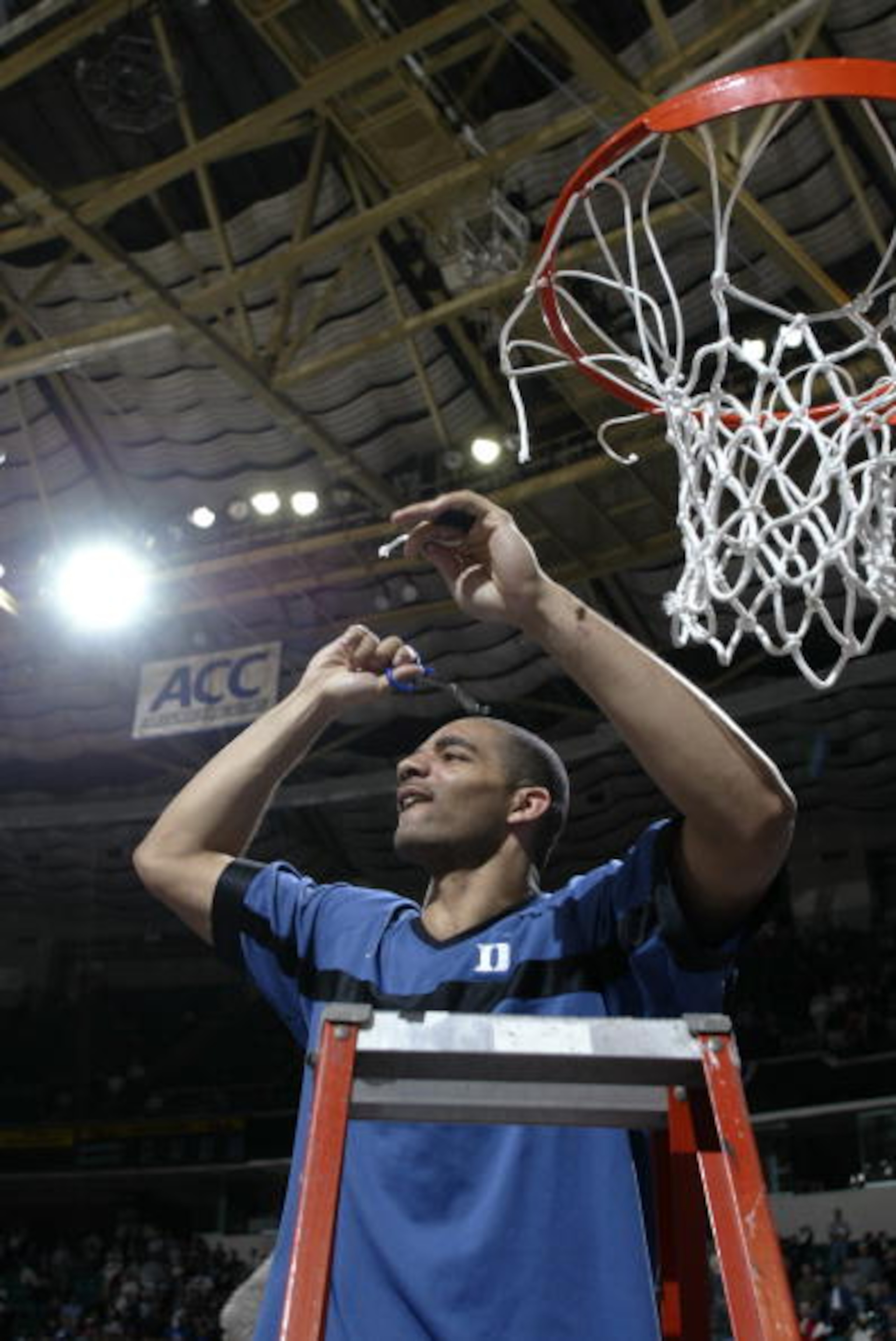 10 Mar 2002:  Carlos Boozer #4 of Duke cuts the nets after winning the ACC Tournament championship game against North Carolina State at the Charlotte Coliseum in Charlotte, North Carolina. Duke defeated North Carolina State 91-61.DIGITAL IMAGE. Mandatory