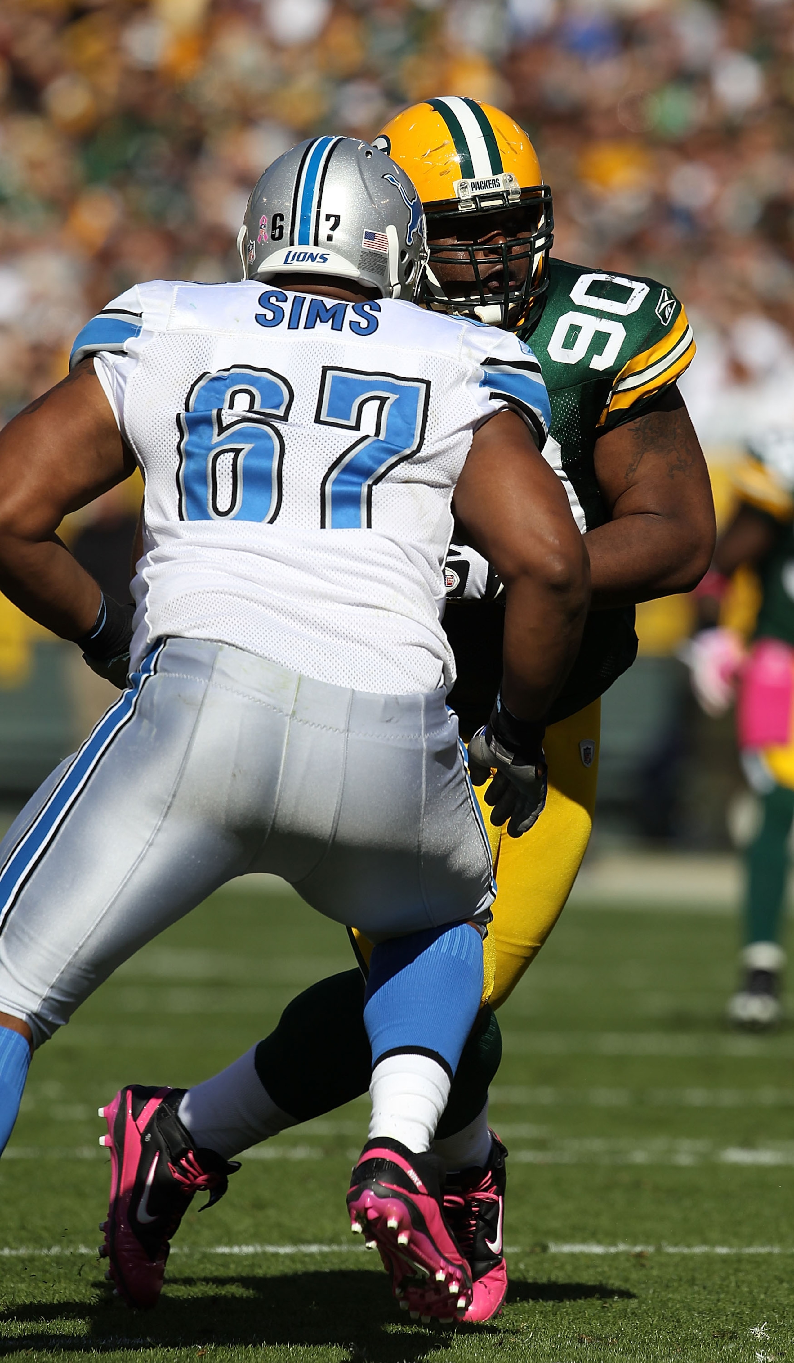 GREEN BAY, WI - OCTOBER 03: B.J. Raji #90 of the Green Bay Packers rushes against Rob Sims #67 of the Detroit Lions at Lambeau Field on October 3, 2010 in Green Bay, Wisconsin. The Packers defeated the Lions 28-26. (Photo by Jonathan Daniel/Getty Images) GREEN BAY, WI - OCTOBER 03: B.J. Raji #90 of the Green Bay Packers rushes against Rob Sims #67 of the Detroit Lions at Lambeau Field on October 3, 2010 in Green Bay, Wisconsin. The Packers defeated the Lions 28-26. (Photo by Jonathan Daniel/Getty Images)
