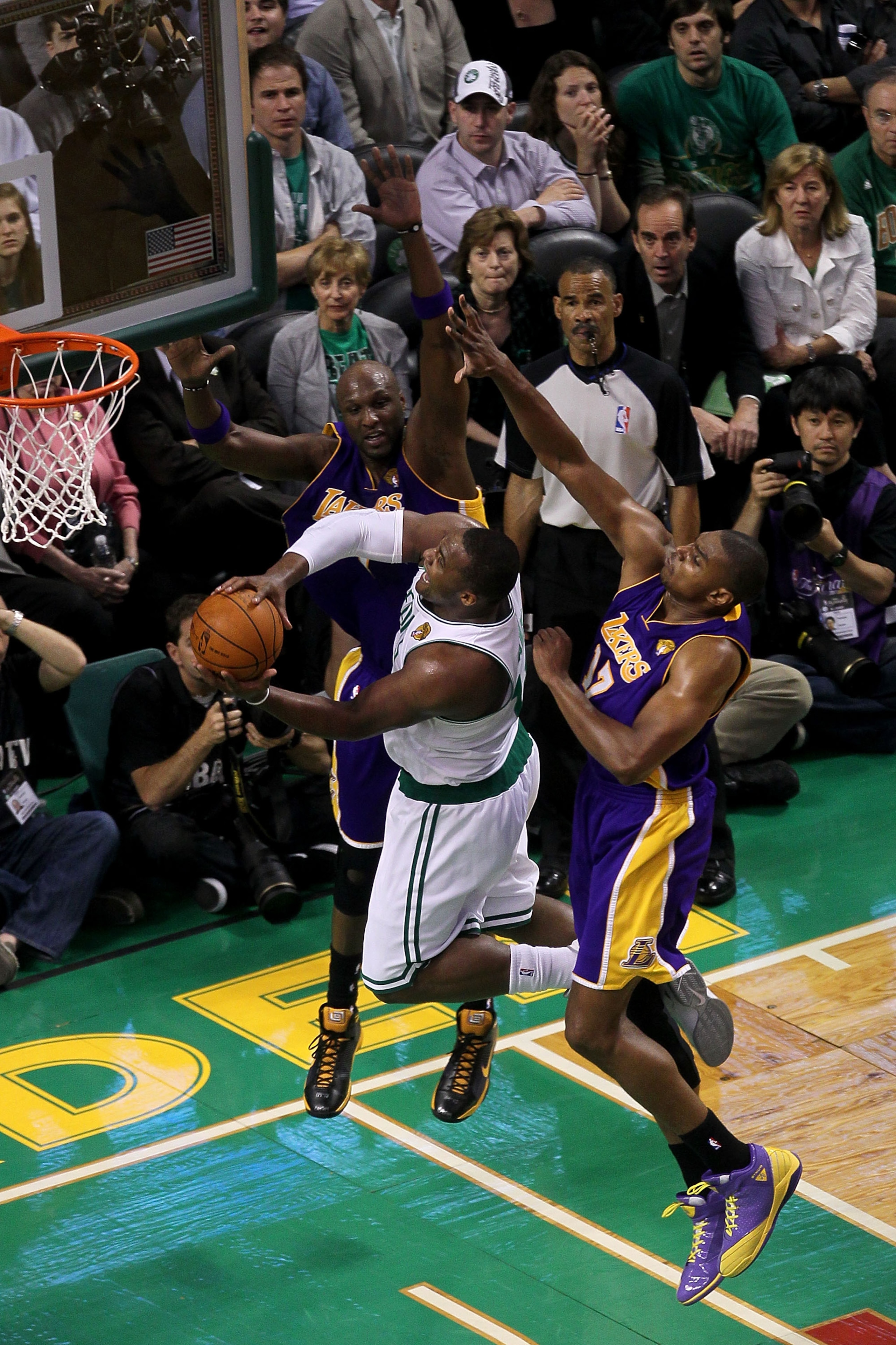 BOSTON - JUNE 08:  Kendrick Perkins #43 of the Boston Celtics lays the ball up against Lamar Odom #7 and Andrew Bynum #17 of the Los Angeles Lakers in Game Three of the 2010 NBA Finals on June 8, 2010 at TD Garden in Boston, Massachusetts. NOTE TO USER: U