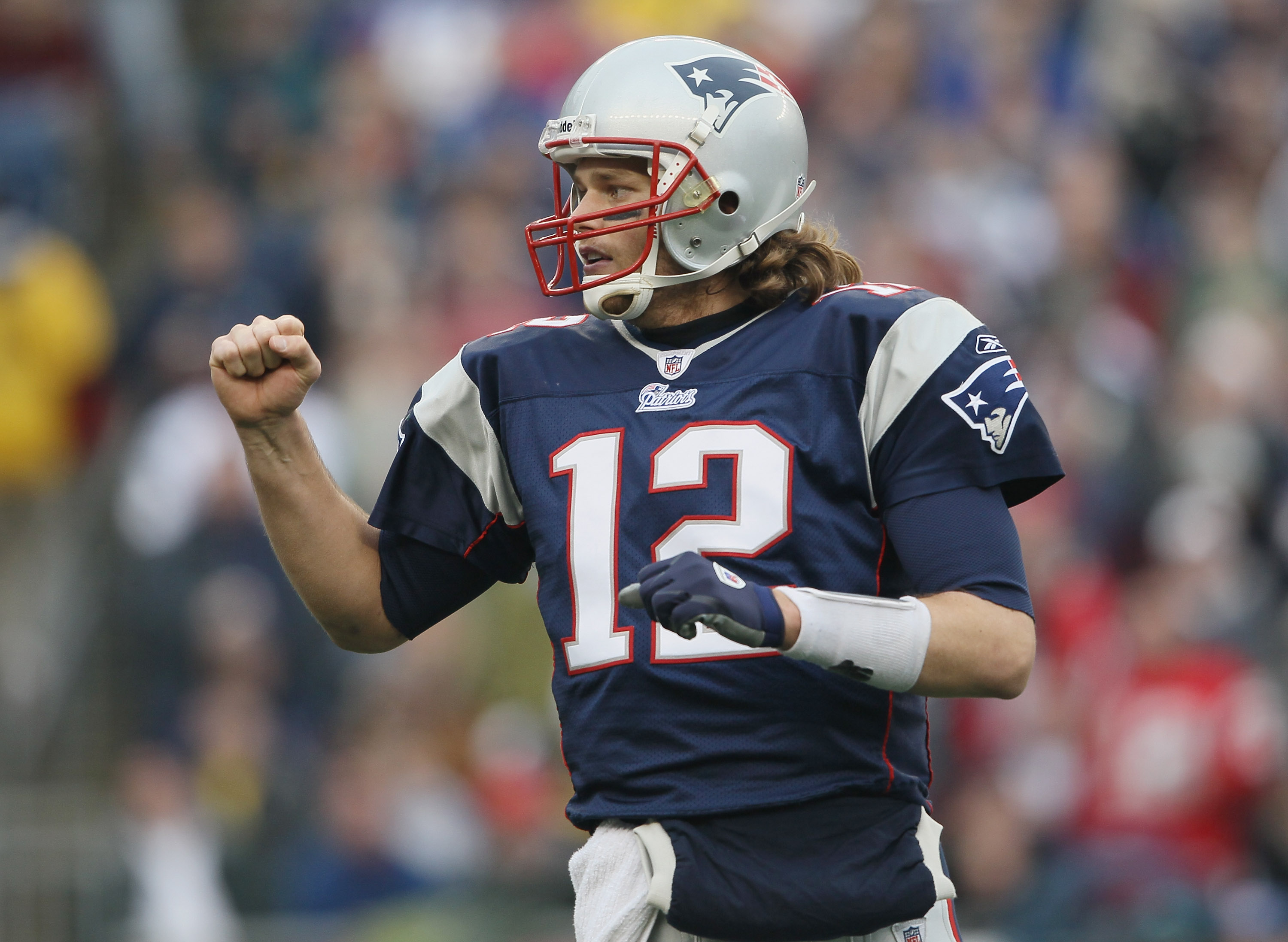 FOXBORO, MA - JANUARY 02: Tom Brady #12 of the New England Patriots celebrates a touchdown by teammate BenJarvis Green-Ellis in the first quarter against the Miami Dolphins on January 2, 2011 at Gillette Stadium in Foxboro, Massachusetts. (Photo by Elsa FOXBORO, MA - JANUARY 02: Tom Brady #12 of the New England Patriots celebrates a touchdown by teammate BenJarvis Green-Ellis in the first quarter against the Miami Dolphins on January 2, 2011 at Gillette Stadium in Foxboro, Massachusetts. (Photo by Elsa