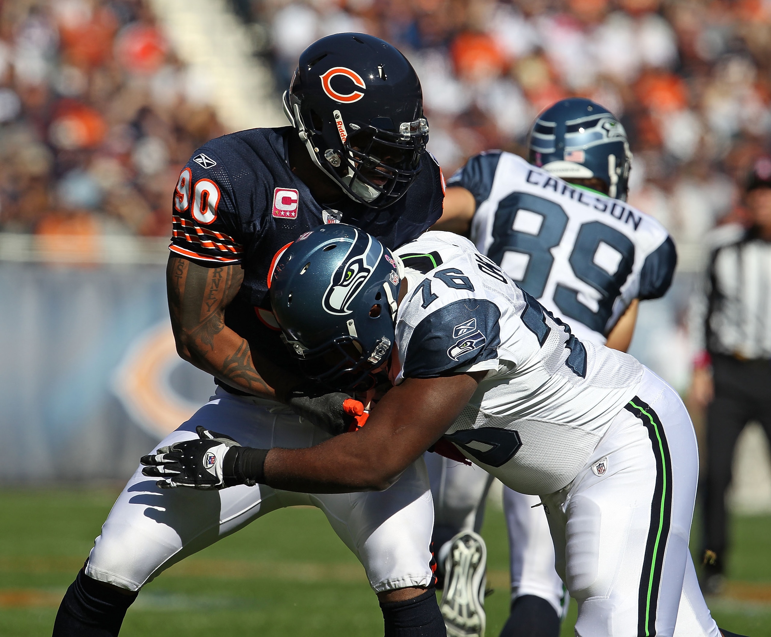 CHICAGO - OCTOBER 17: Julius Peppers #90 of the Chicago Bears rushes against Russell Okung #76 of the Seattle Seahawks at Soldier Field on October 17, 2010 in Chicago, Illinois. The Seahawks defeated the Bears 23-20. (Photo by Jonathan Daniel/Getty Images CHICAGO - OCTOBER 17: Julius Peppers #90 of the Chicago Bears rushes against Russell Okung #76 of the Seattle Seahawks at Soldier Field on October 17, 2010 in Chicago, Illinois. The Seahawks defeated the Bears 23-20. (Photo by Jonathan Daniel/Getty Images